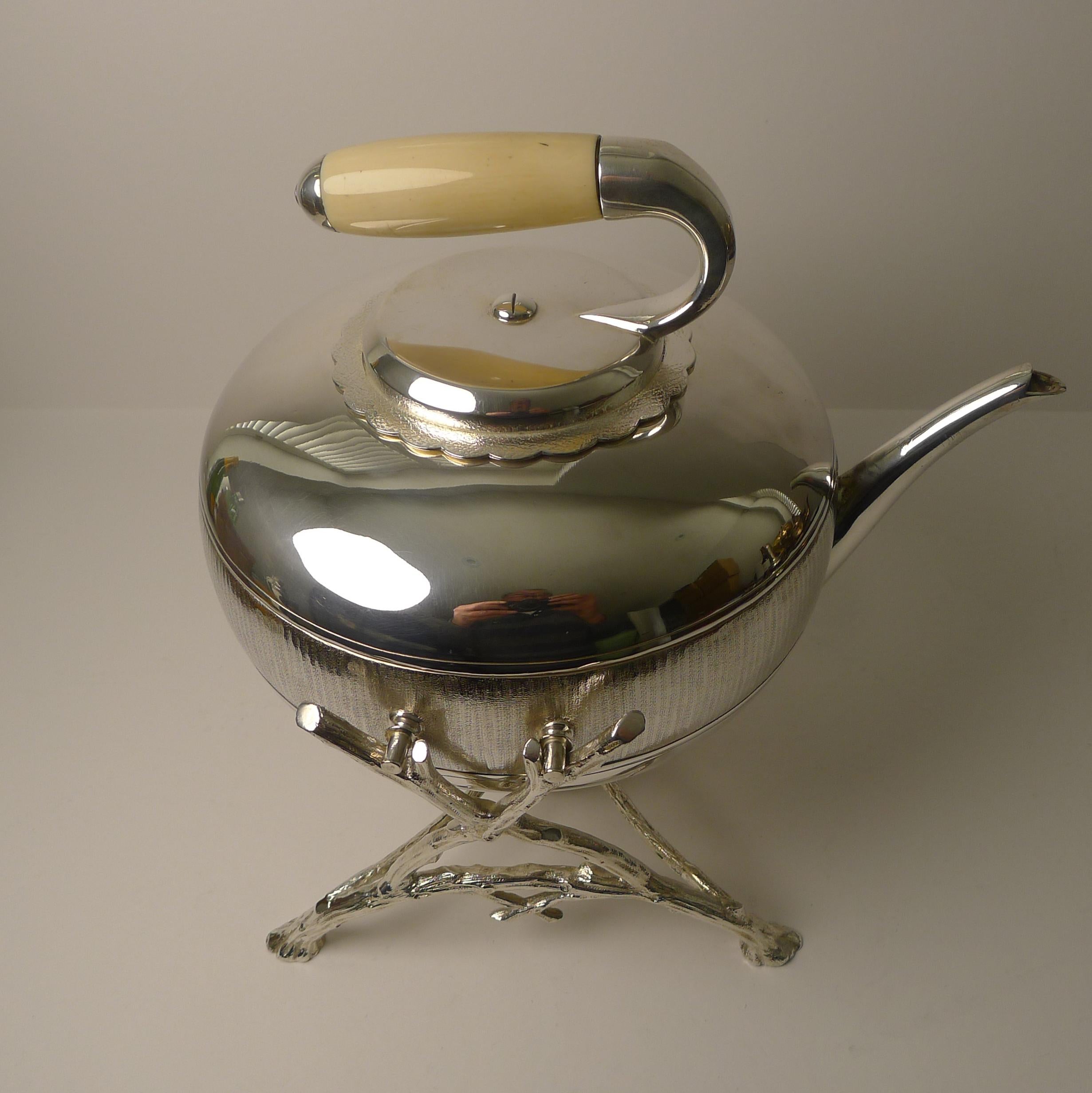 A rare novelty Victorian spirit kettle dating to c.1880.

Made from English silver plate, the kettle in the form of a curling stone sits in it's original naturalistic stand and retains it's original spirit burner underneath which would have been