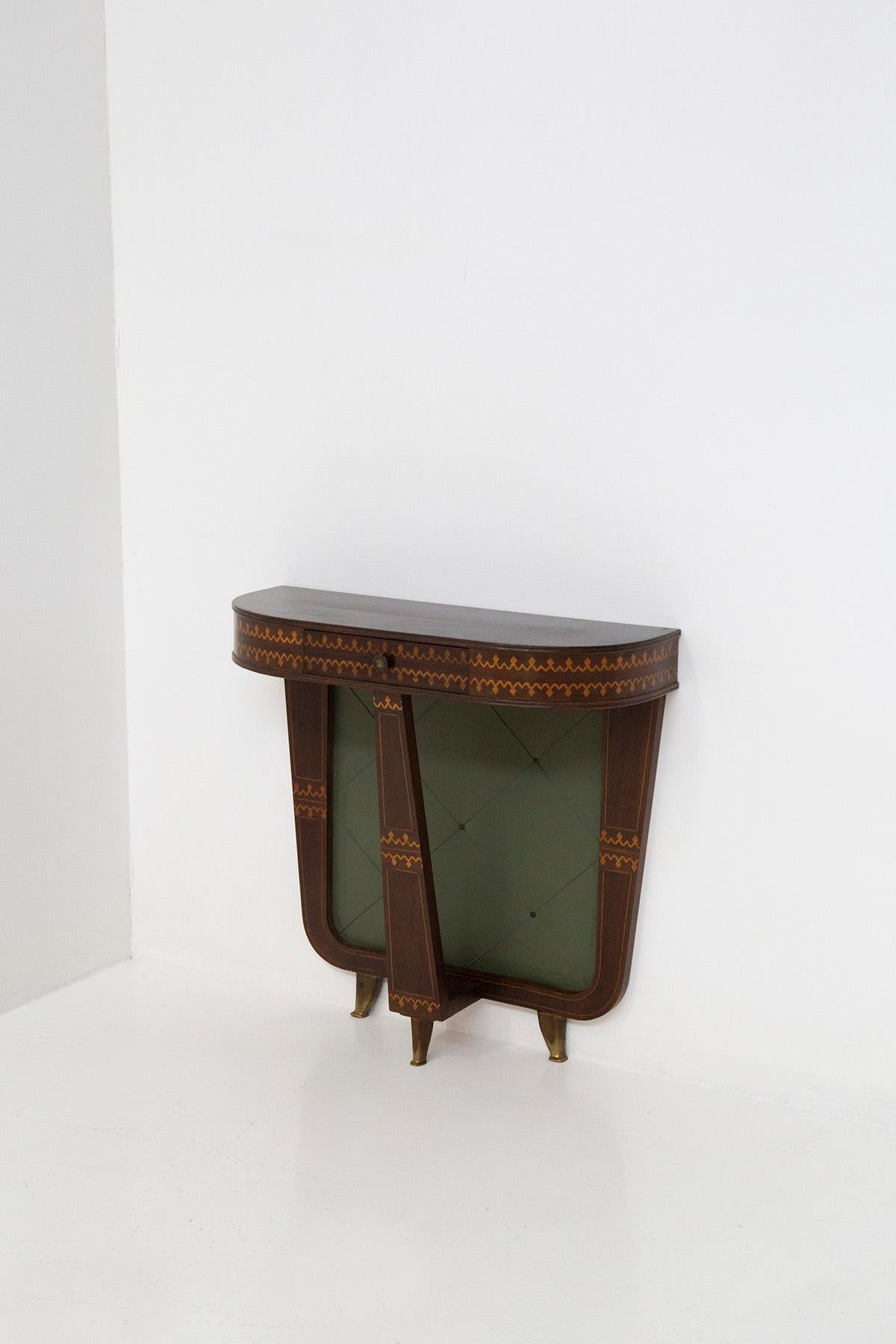 Rare and elegant Italian entrance console by Paolo Buffa from the 1950s. The console features a wooden frame with truly remarkable and fine inlays. The console features a countertop with beveled corners to create harmony with the entire structure.