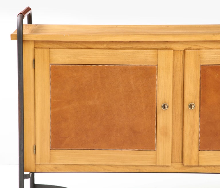 Rare and Exceptional Equestrian-Style Cabinet in Ash, Leather, and Iron by Jacques Adnet, France, c. 1950s.