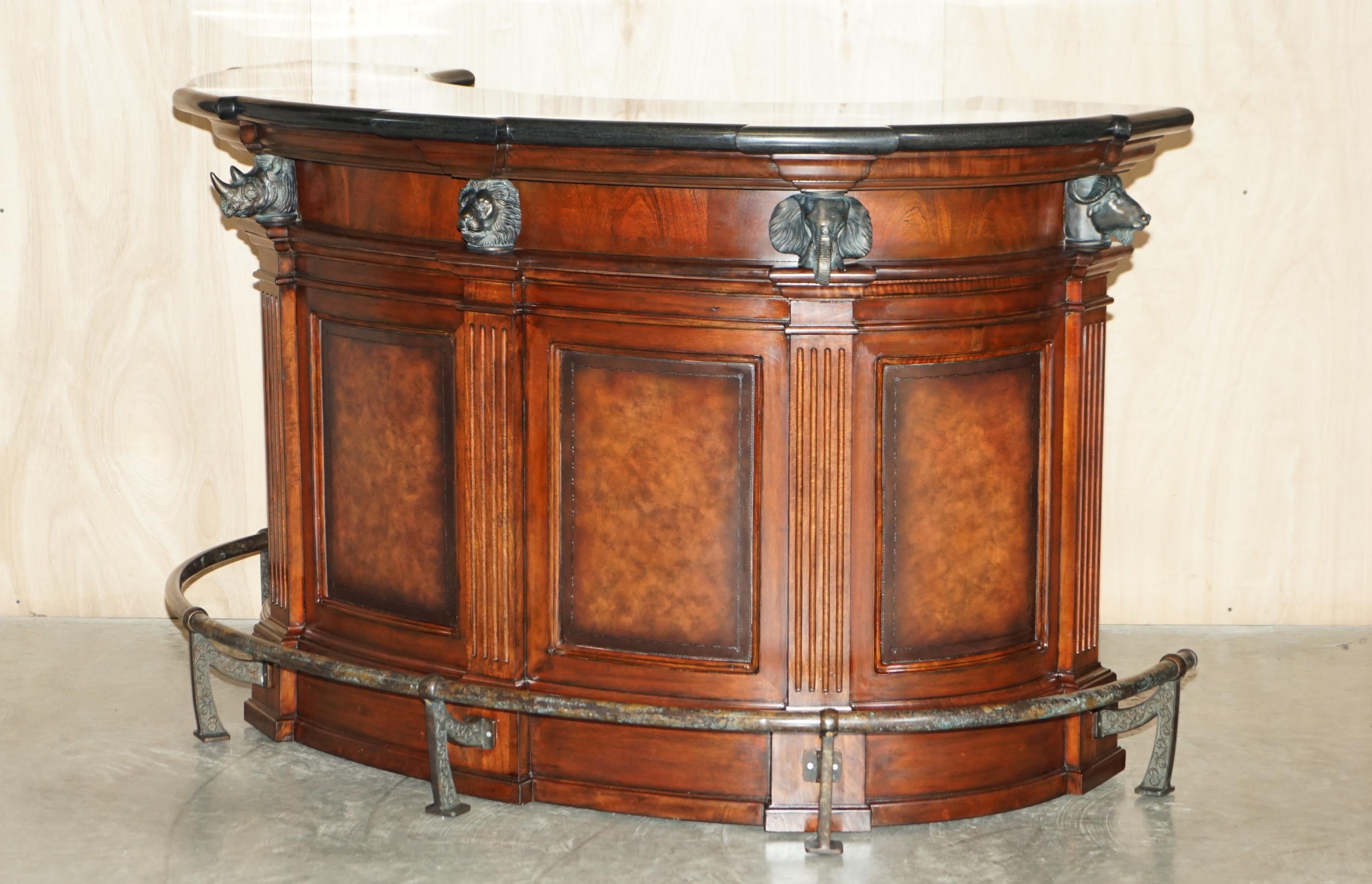 We are delighted to offer for sale this absolutely stunning Ernest Hemmingway Trophy bar and two brown leather revolving bar stools.

An absolutely stunning bar, truly sublime, it has a patchwork fossil stone top and worksurface which is surmounted
