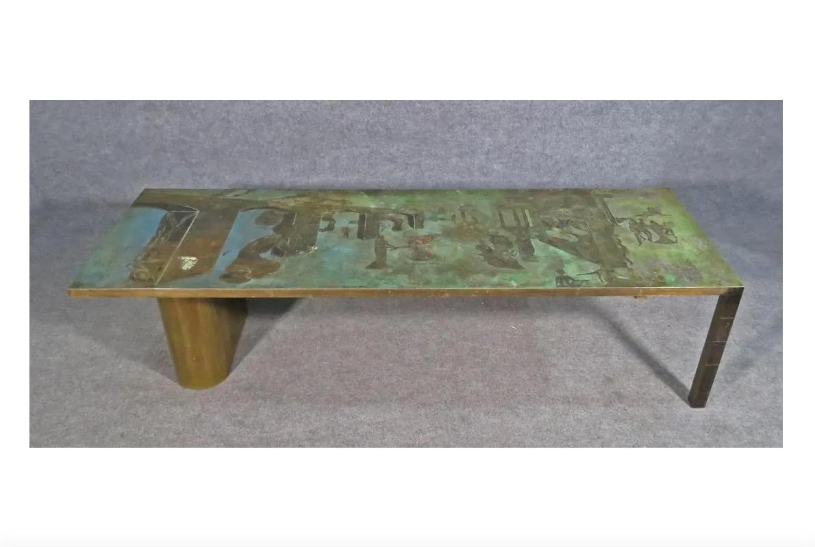 Displaying an etched relief on the table's top in a variety of patinated colors, this incredible and rare metal coffee table by Phillip and Kelvin LaVerne is a true collector's item. Please confirm item location with seller (NY/NJ).