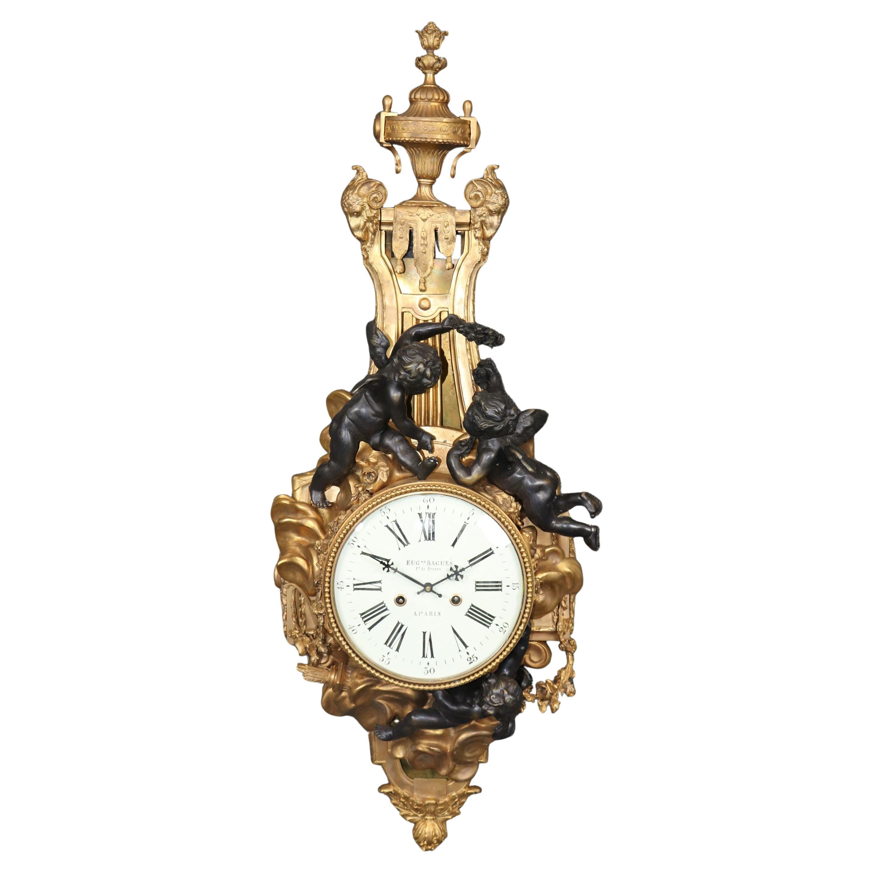 Rare Eugene Bagues Dark and Bright Bronze French Cartel Clock with Putti For Sale
