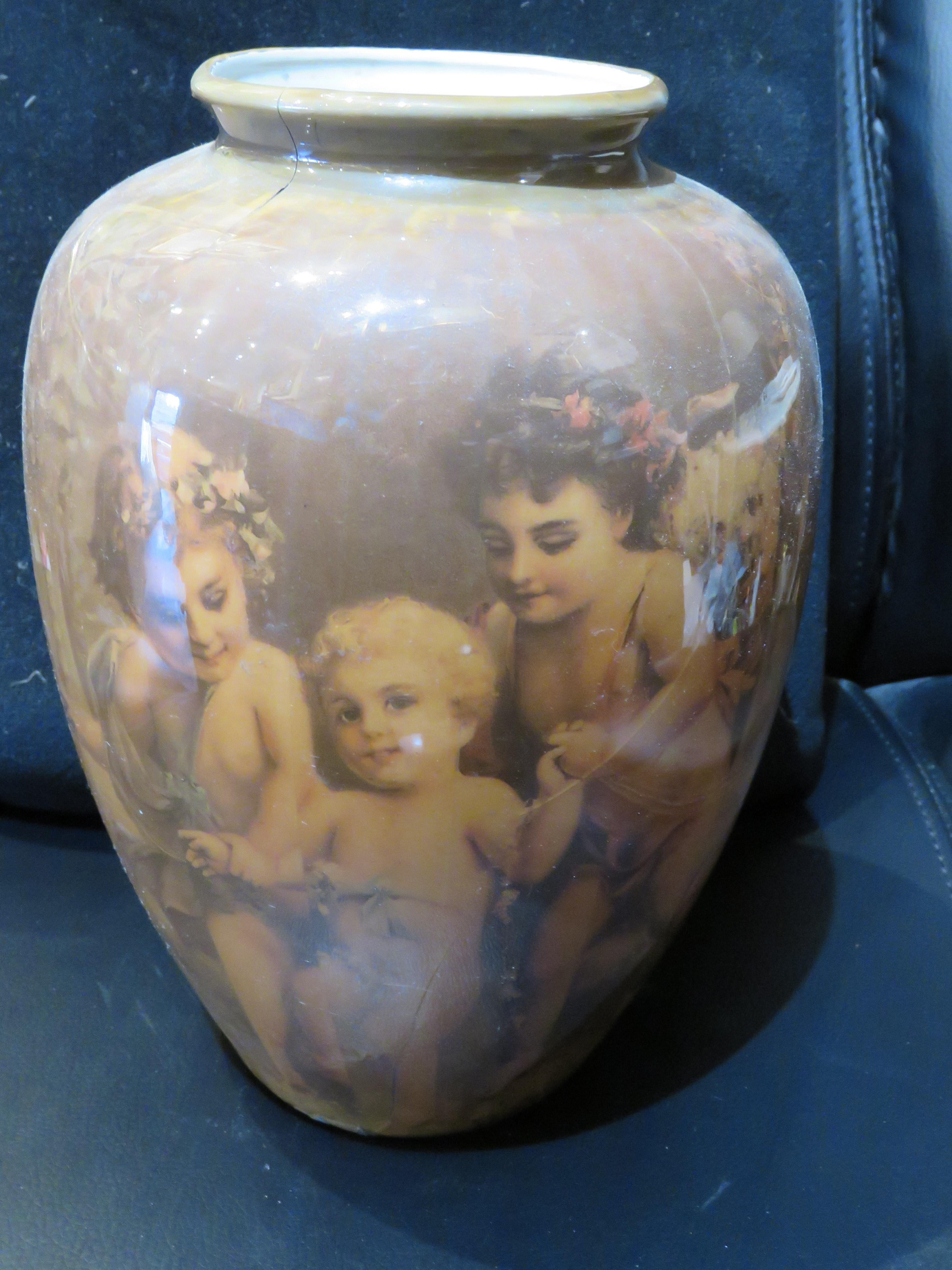 The Following Items we are offering is a Rare Important Estate Antique Vase of Cherub Angelic Children glossy overlay Porcelain Vase Depicting Three Children Standing together Holding Wreath of Garland and another sitting with a Basket of Apples.