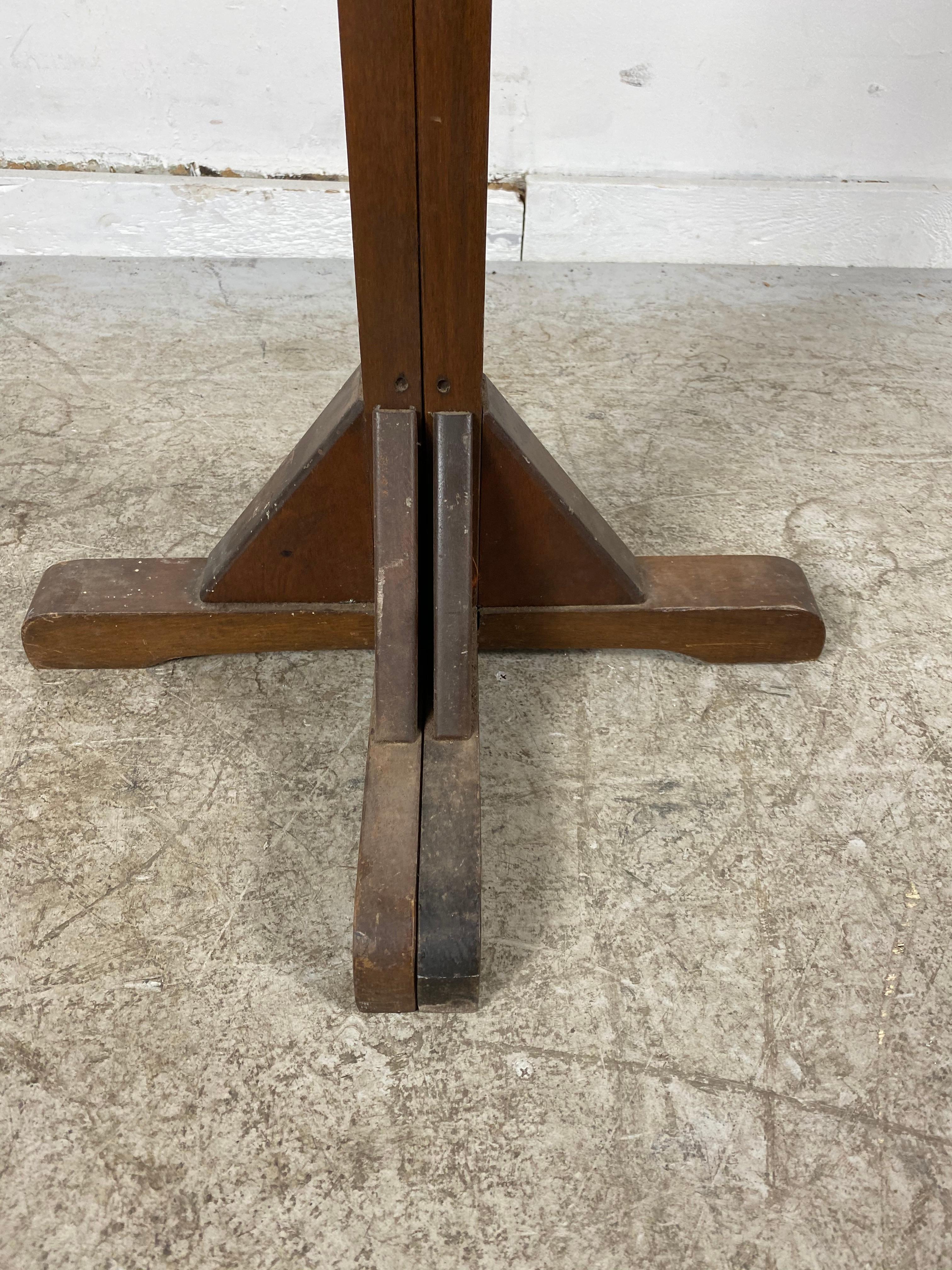 Rare and unusual expanding Arts & Crafts free standing coat tree or stand, ingenious design, traditional coat tree that expands to create coat rack, retains original finish, patina as well as original brass hooks, measurements: closed 18