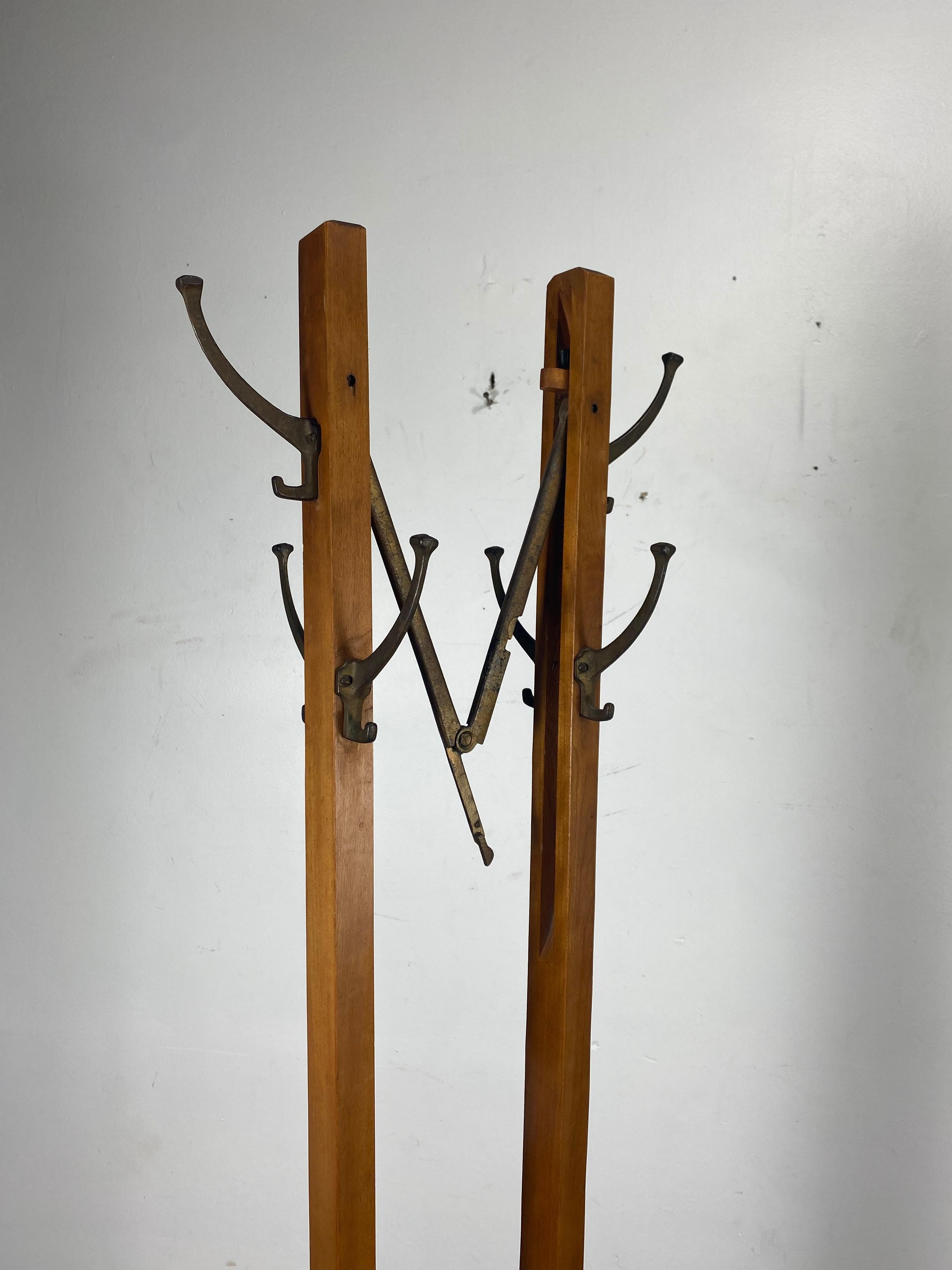 Rare and unusual expanding Arts & Crafts free standing coat tree or stand, ingenious design, traditional coat tree that expands to create coat rack, retains original finish, patina as well as original brass hooks, measurements: closed 18