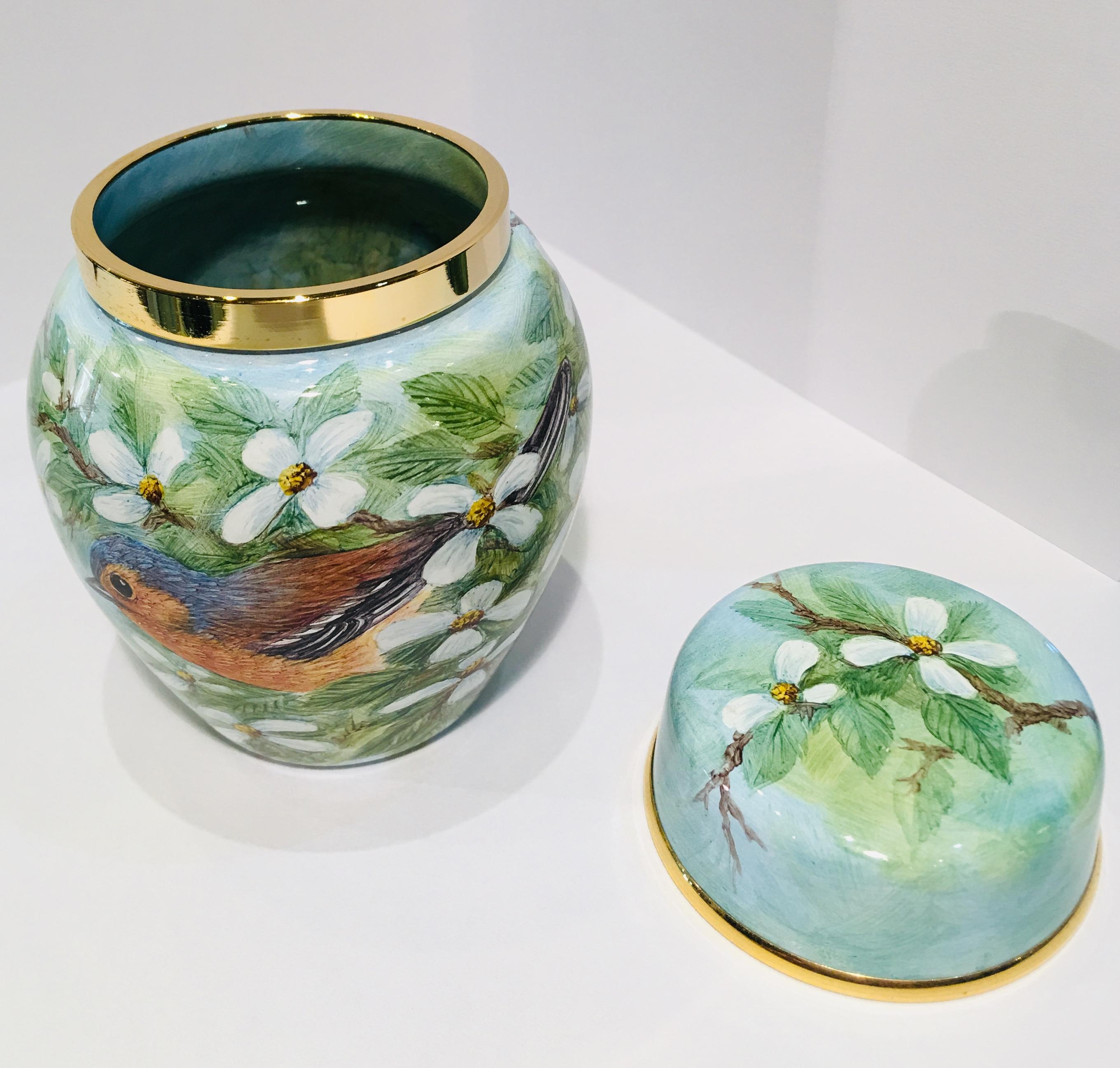 Finest quality handmade and hand painted enamel miniature ginger jar or lidded vase, in perfect condition, features a gilt metal rim and lid (also with gilt metal rim) made by Moocroft.  Limited edition of only 75 pieces made.  Outside of jar