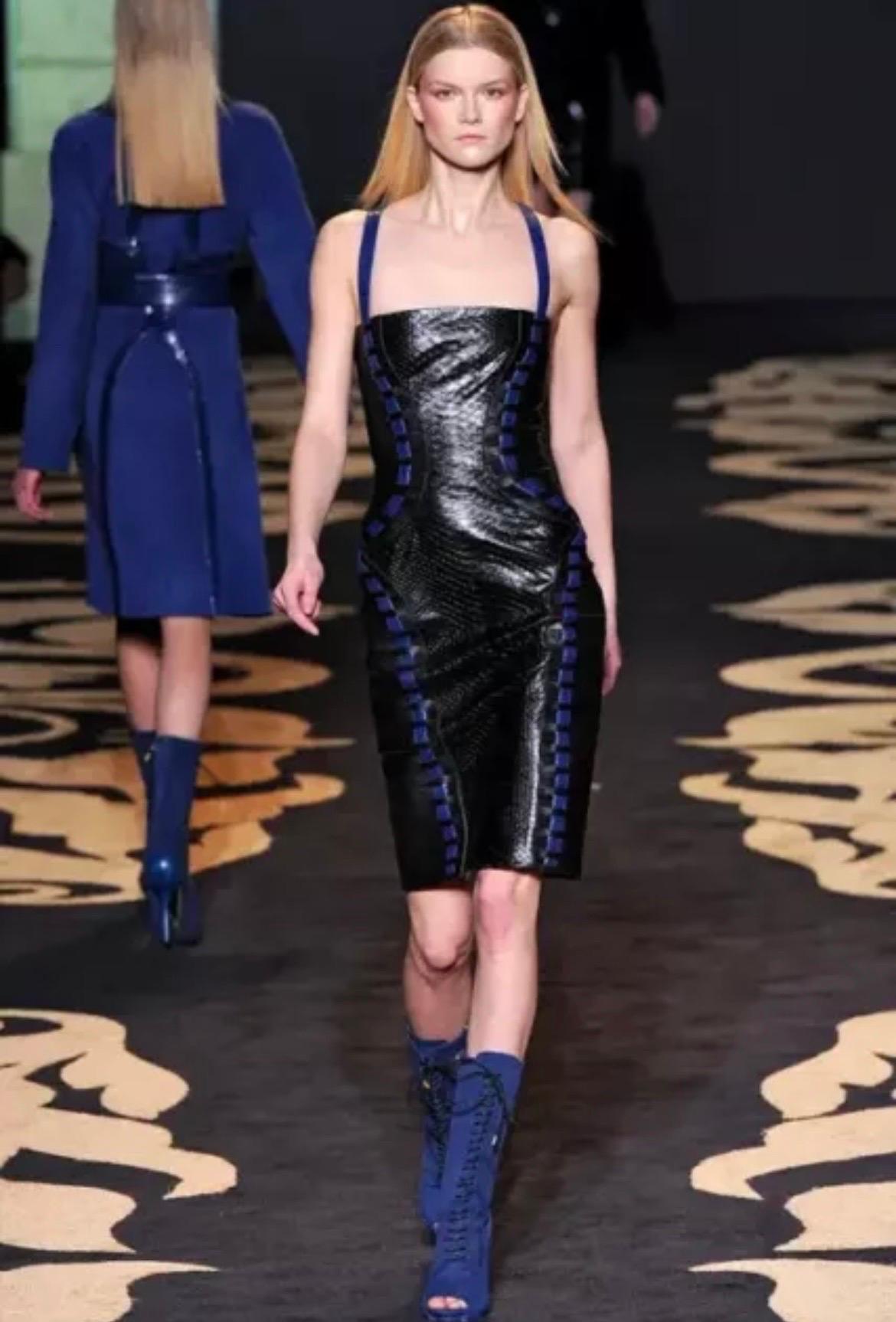 VERSACE

Fall/Winter 2011 look # 35
Model Constance Jablonski partied with fellow Angels after the Victoria's Secret Fashion Show wearing a sexy Versace leather dress. 
If you're looking for that incredible dress then you are in luck....HERE'S is