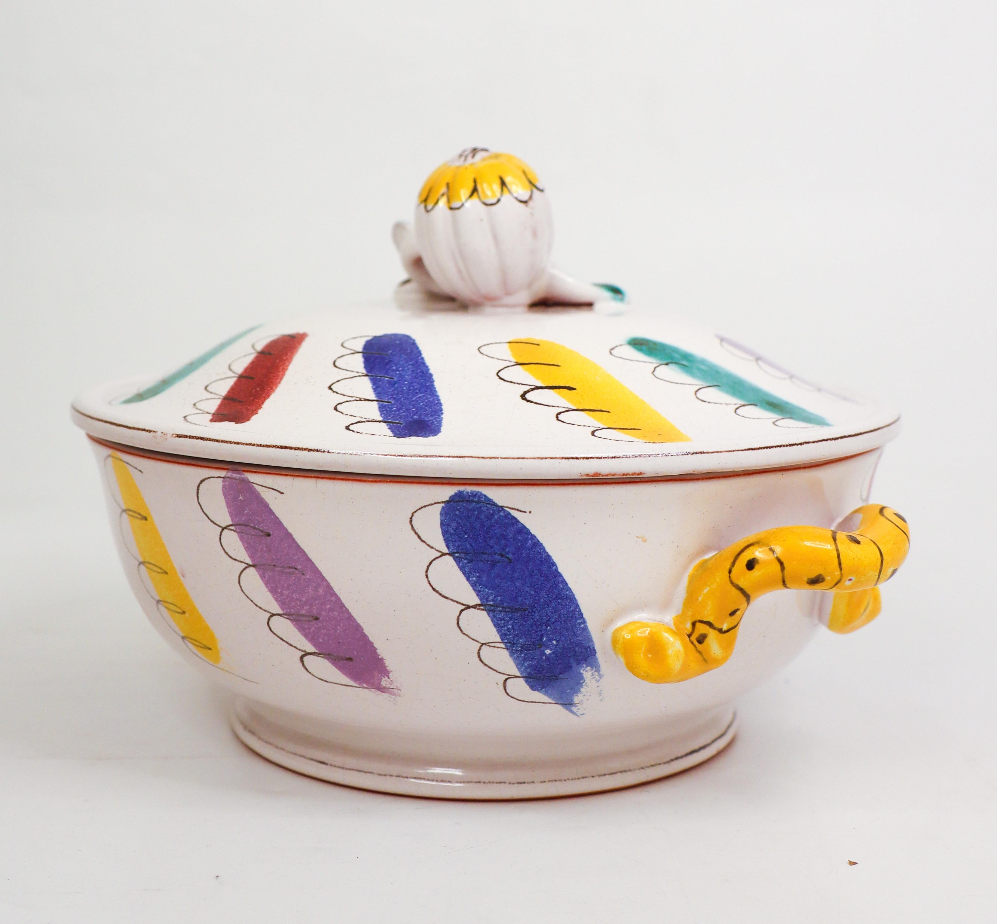 Ursula Printz was one of Stig Lindbergs most appreciated faience painters, she also made some own pieces which this is. The shape is also used by many of Stig Lindbergs items. This tureen or lidded bowl is 24 cm (9,6