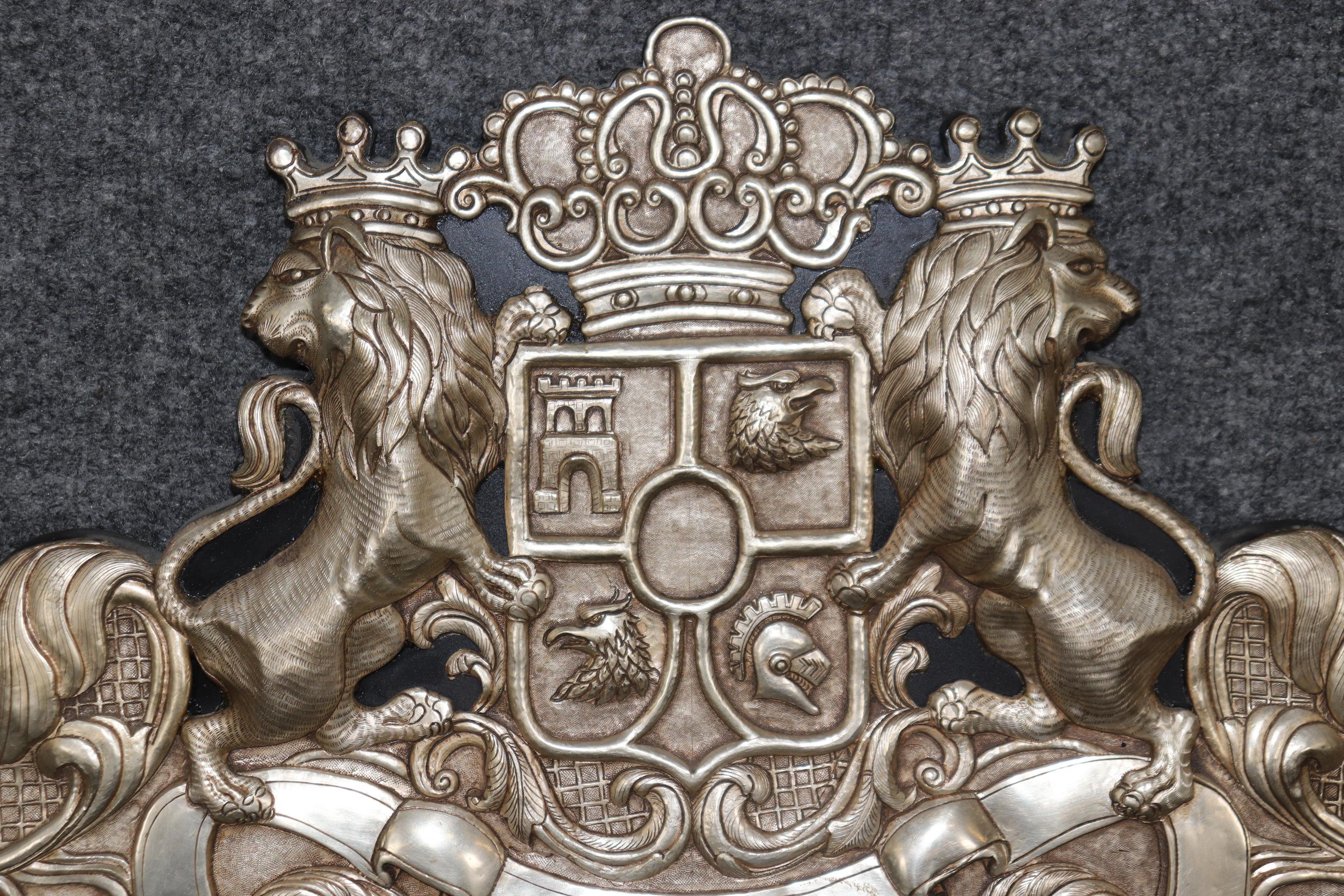 This is a superb, incredibly unique and interesting piece of one family's history. Unfortunately, we don't know which family, but it could be yours! The pair of crowned lions stand next to a familial coat of arms that includes a pair of opposing