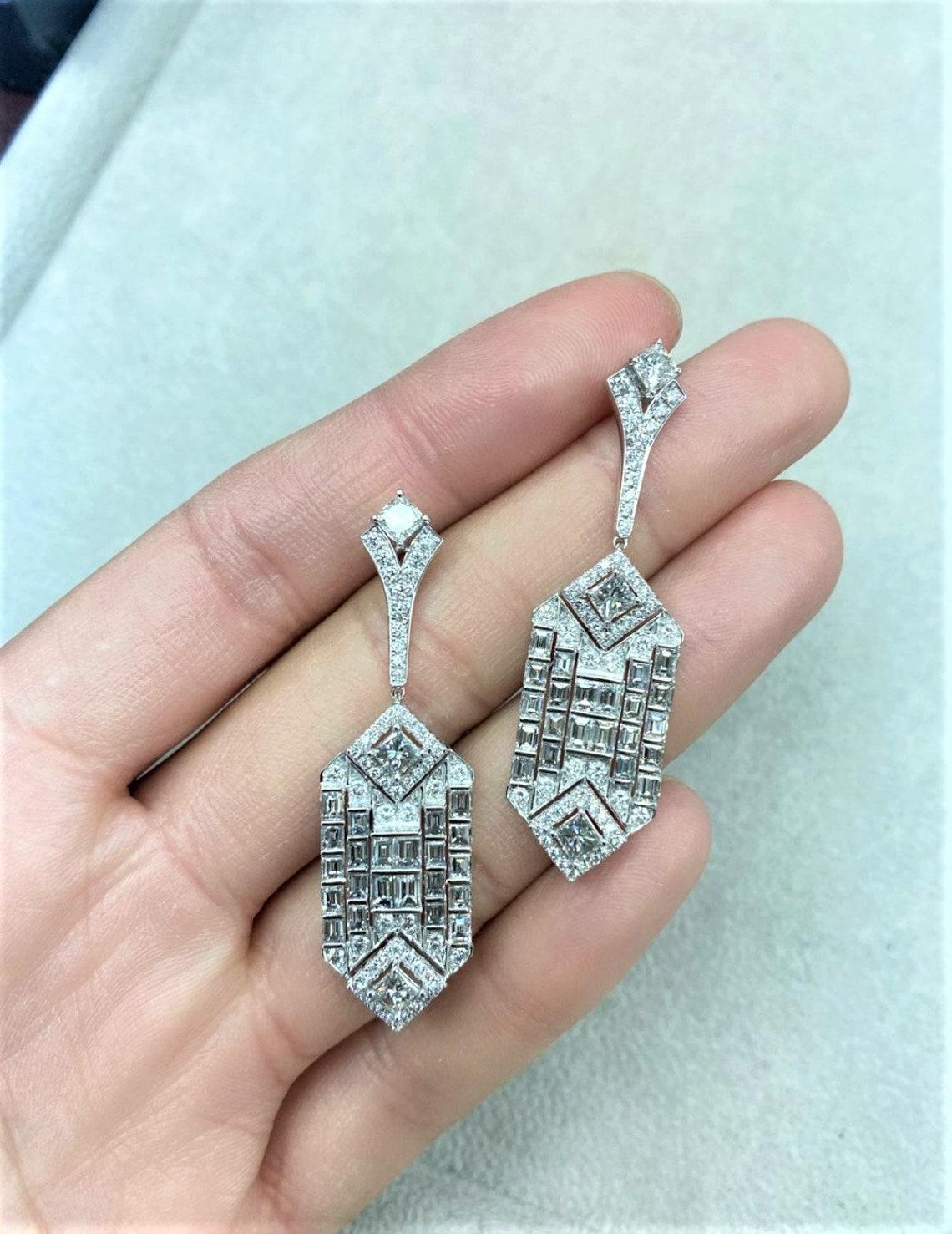 The Following Item we are offering is a Rare Important Radiant Platinum Gold Gorgeous Glittering Deco Style Diamond Earrings. Each Earring Features Spectacular Glittering Fancy Draping Diamonds set in Platinum and 18KT Gold!! Stones are Very Clean