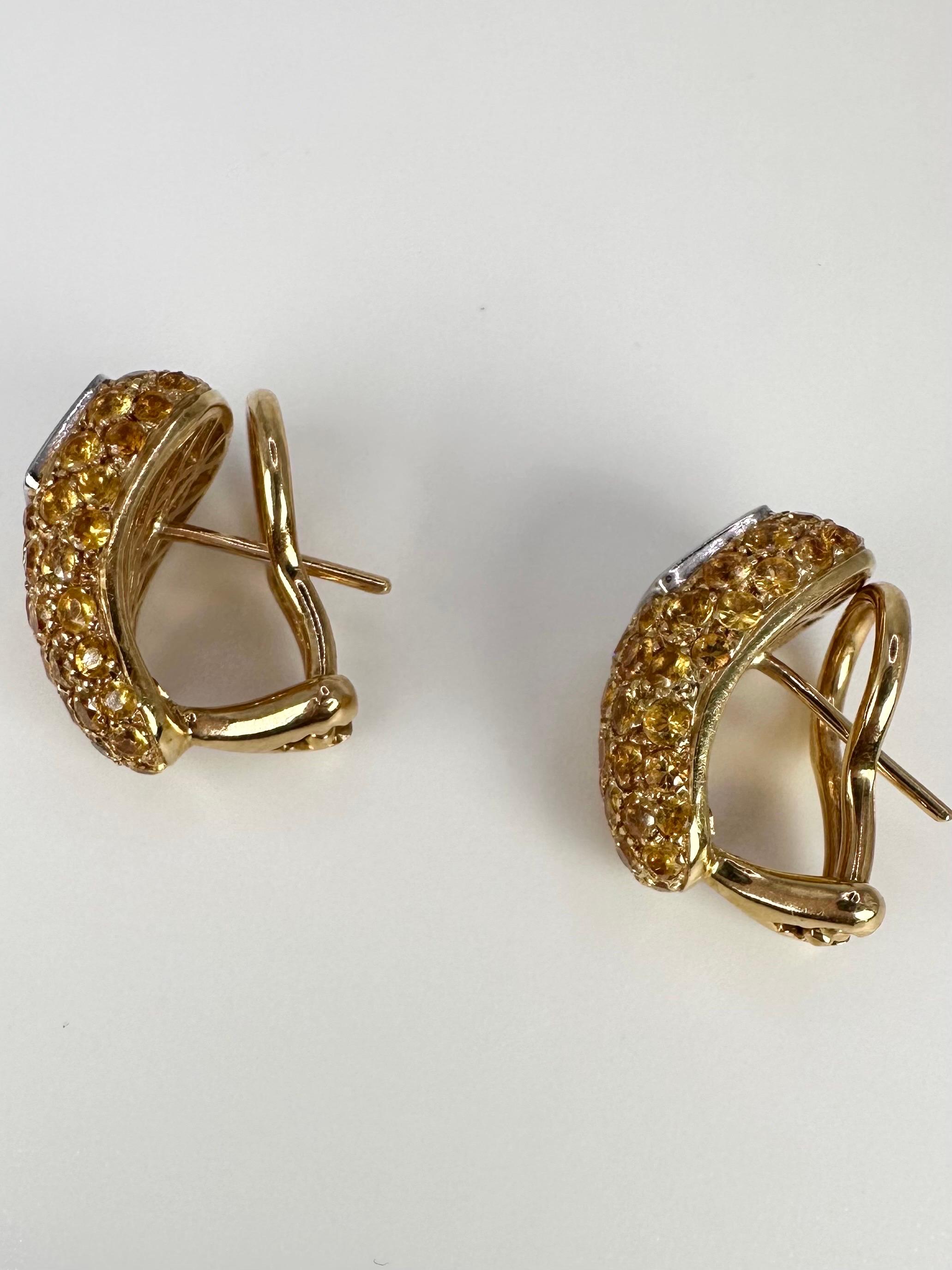 Fancy yellow diamond earrings, made with excellent craftsmanship. The pave setting makes the diamonds sparkle more than anything. The earrings are made in 18KT yellow gold with Omega backing.

GOLD: 18KT gold
NATURAL DIAMOND(S)
Clarity/Color: