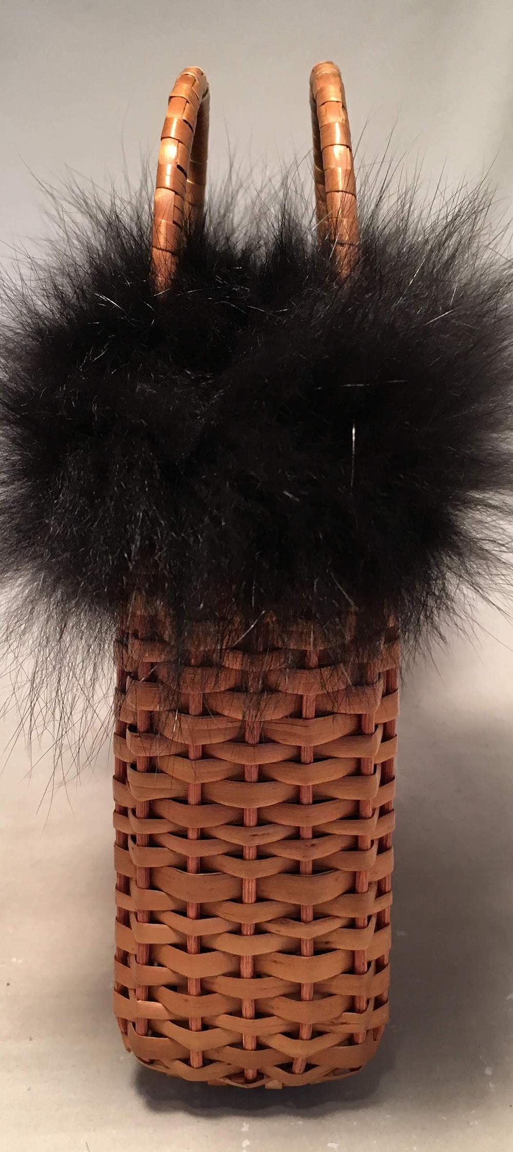 RARE Fendi Mini Wicker Basket Handbag with Black Fox Fur Trim in excellent condition. Tan wicker basket exterior trimmed with soft black fox fur along top edge. Zucca monogram canvas lined interior and 2 top curved wicker wrapped handles. No stains,