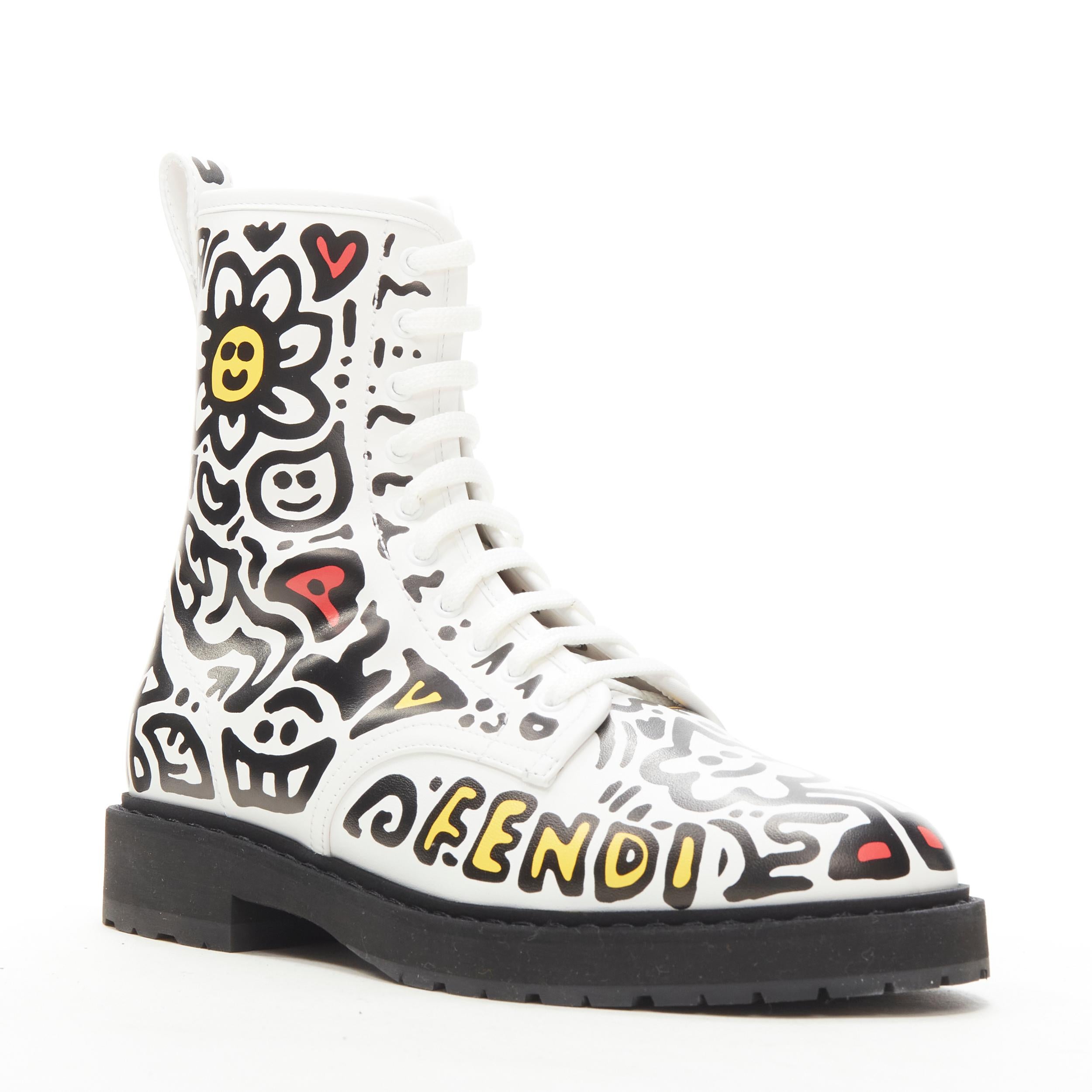 rare FENDI MR DOODLE white logo graffiti print laced combat ankle boot EU36 
Reference: ANWU/A00375 
Brand: Fendi 
Collection: Mr Doodle Runway 
Material: Leather 
Color: White 
Pattern: Graffiti 
Closure: Zip 
Extra Detail: White leather with