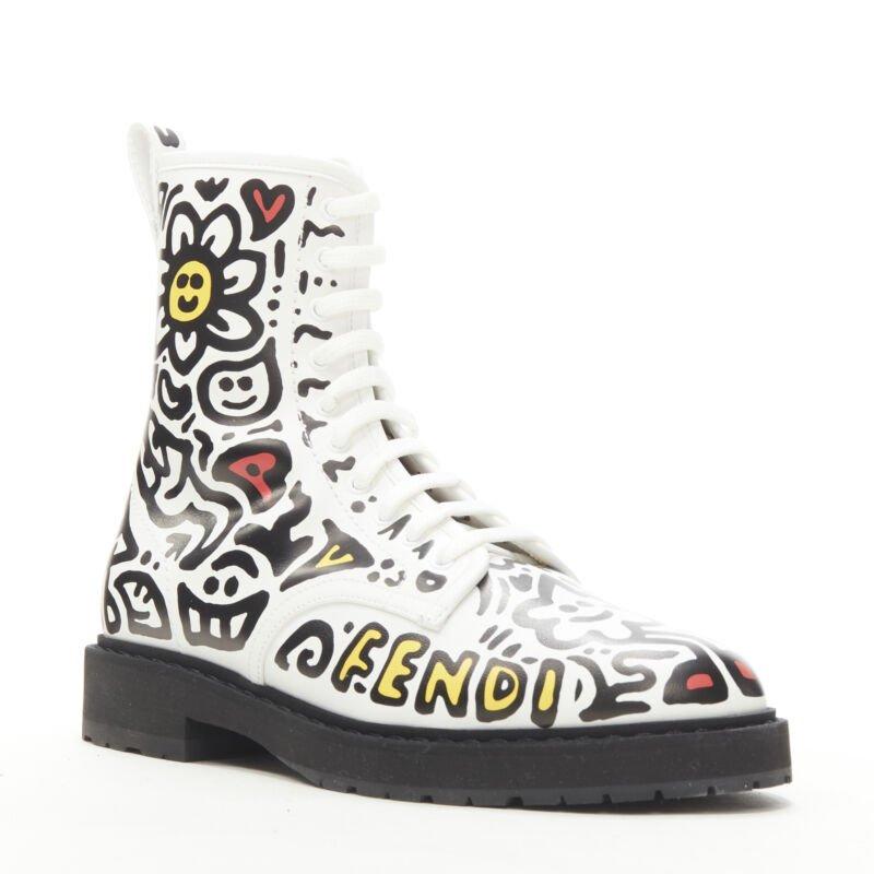 rare FENDI MR DOODLE white logo graffiti print laced combat ankle boot EU36
Reference: ANWU/A00375
Brand: Fendi
Collection: Mr Doodle - Runway
Material: Leather
Color: White, Black
Pattern: Graffiti
Closure: Zip
Lining:  Leather
Extra Details: White
