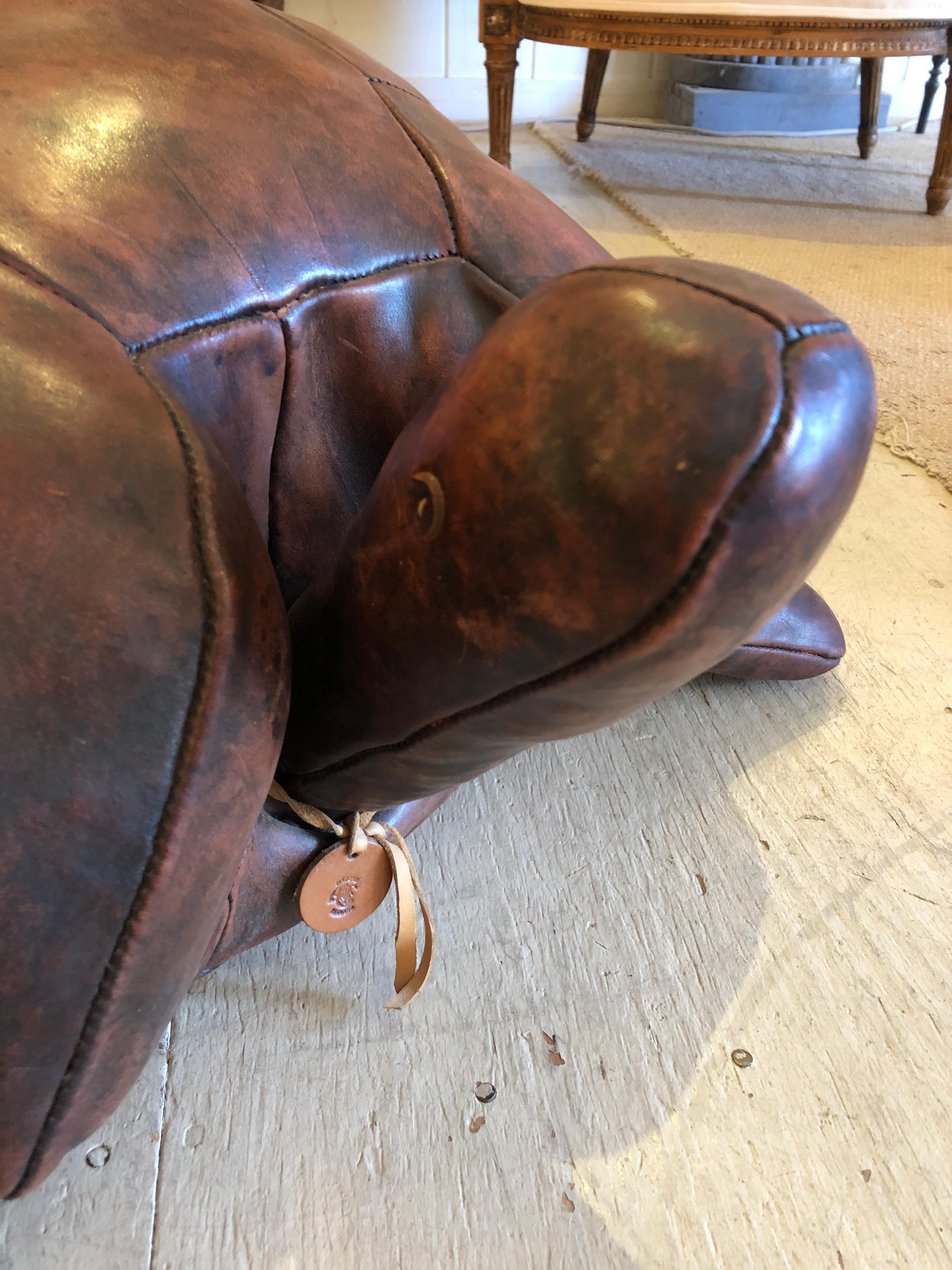 The focal point show stealer in any room, a rare vintage brown leather ottoman in the shape of a handsome giant turtle. Made in England AF tag, superb condition.