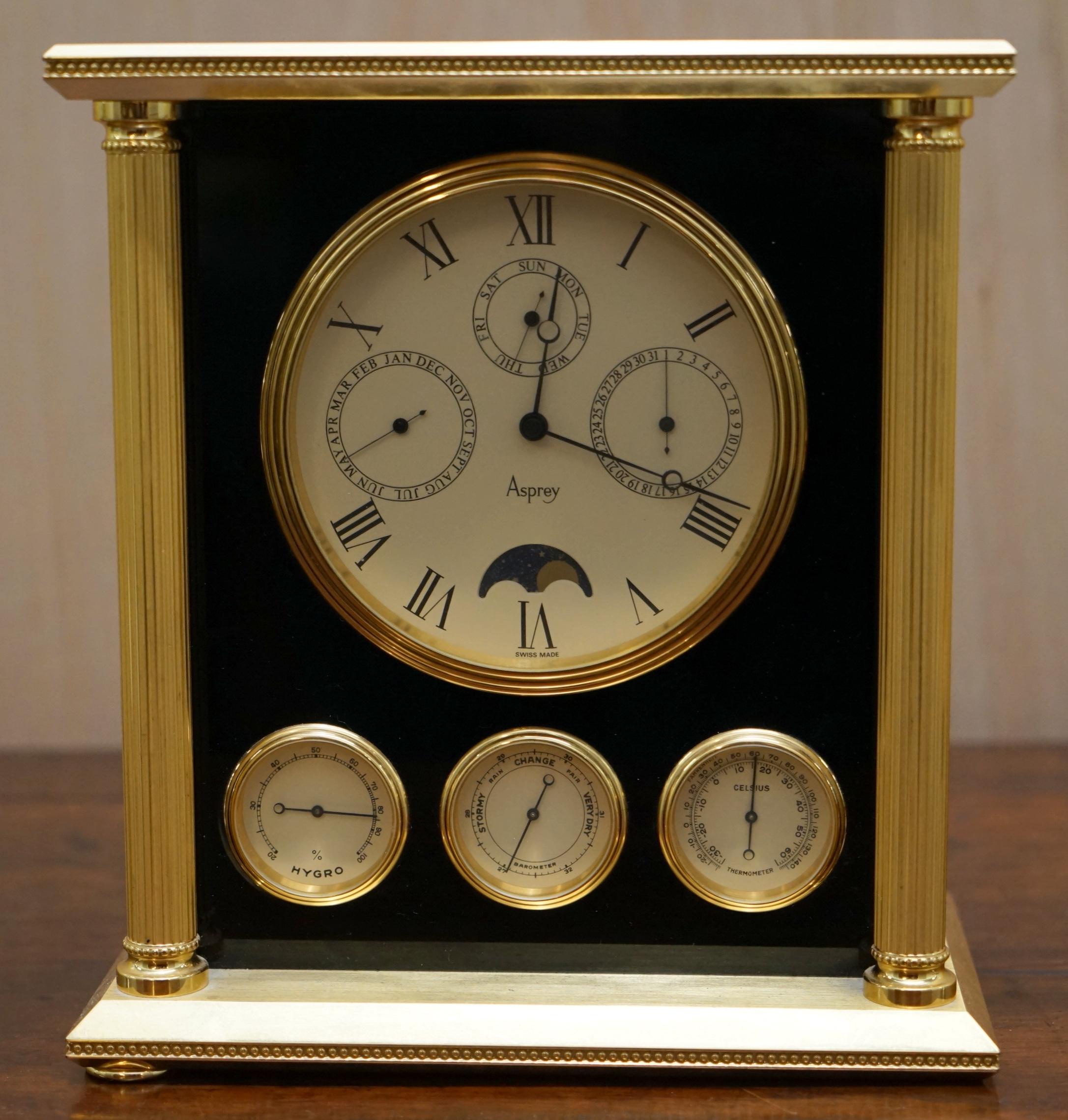 Wimbledon-Furniture

Wimbledon-Furniture is delighted to offer for sale this stunning exceptionally heavy solid brass with smoked glass panels Asprey London Swiss made mantle clock with built in Moon Phase, Calendar and Barometer

This clock has