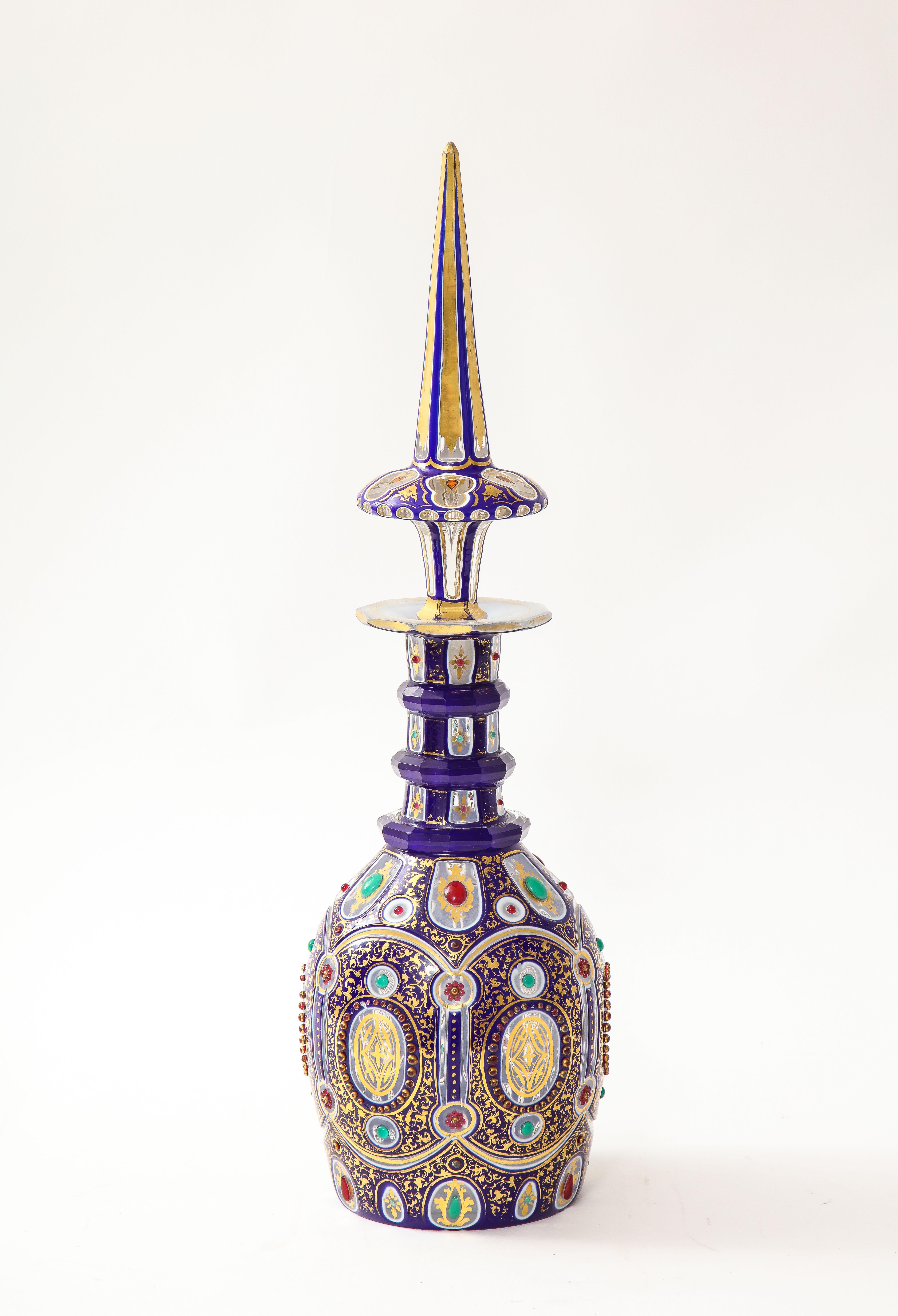 A Fine, Rare, and Highly Important 19th Century Bohemian Blue-Over-White-Over-Clear Triple Overlay Crystal Jeweled and Covered Imperial Decanter. The decanter is crafted from clear glass which is partially covered with a blue-over-white overlay,