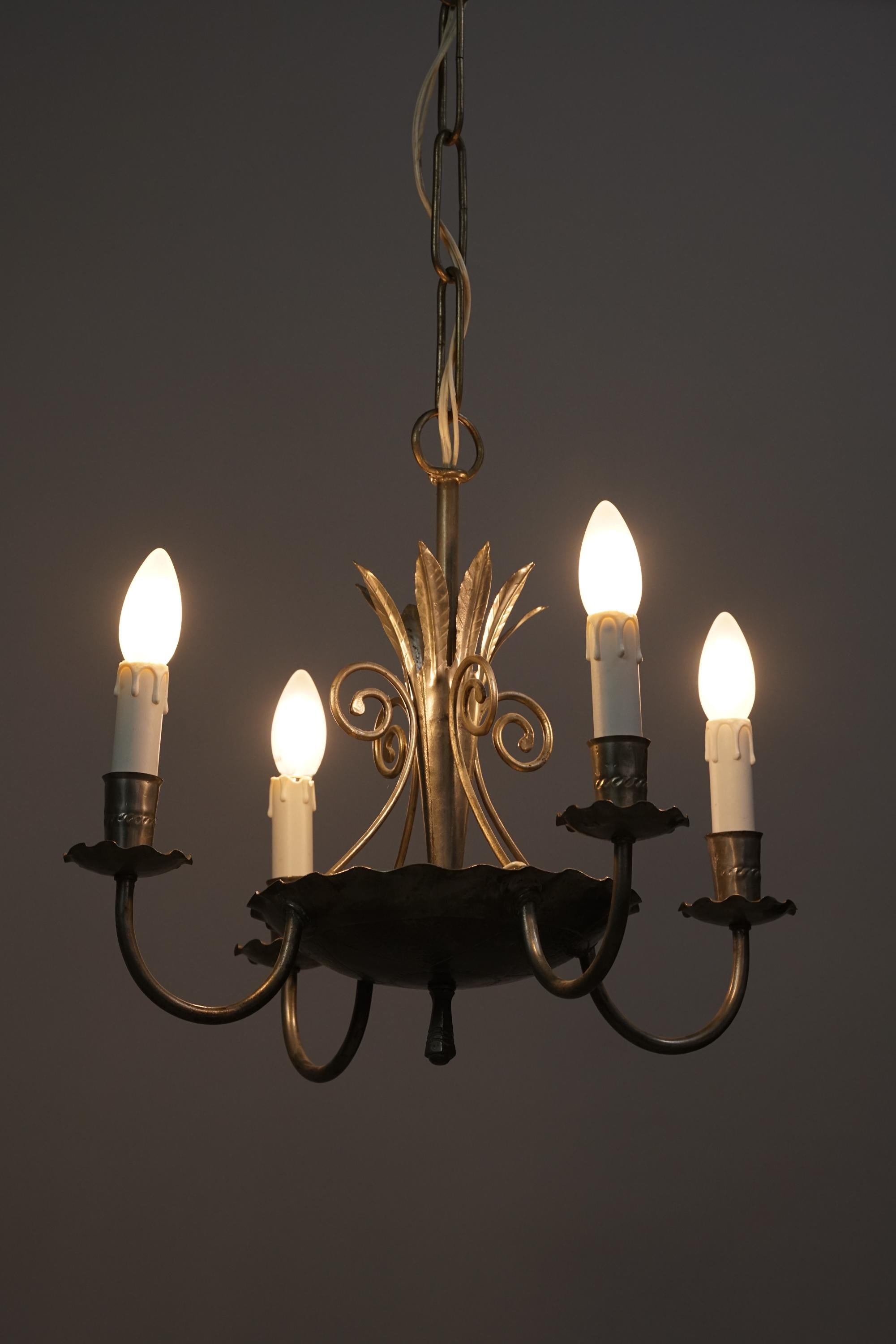 Rare Finnish iron chandelier from the 1940s, possibly manufactured by Taito Oy, attributed to Paavo Tynell. Forged iron, beautiful intricate details, good vintage condition, minor wear consistent with age and use.