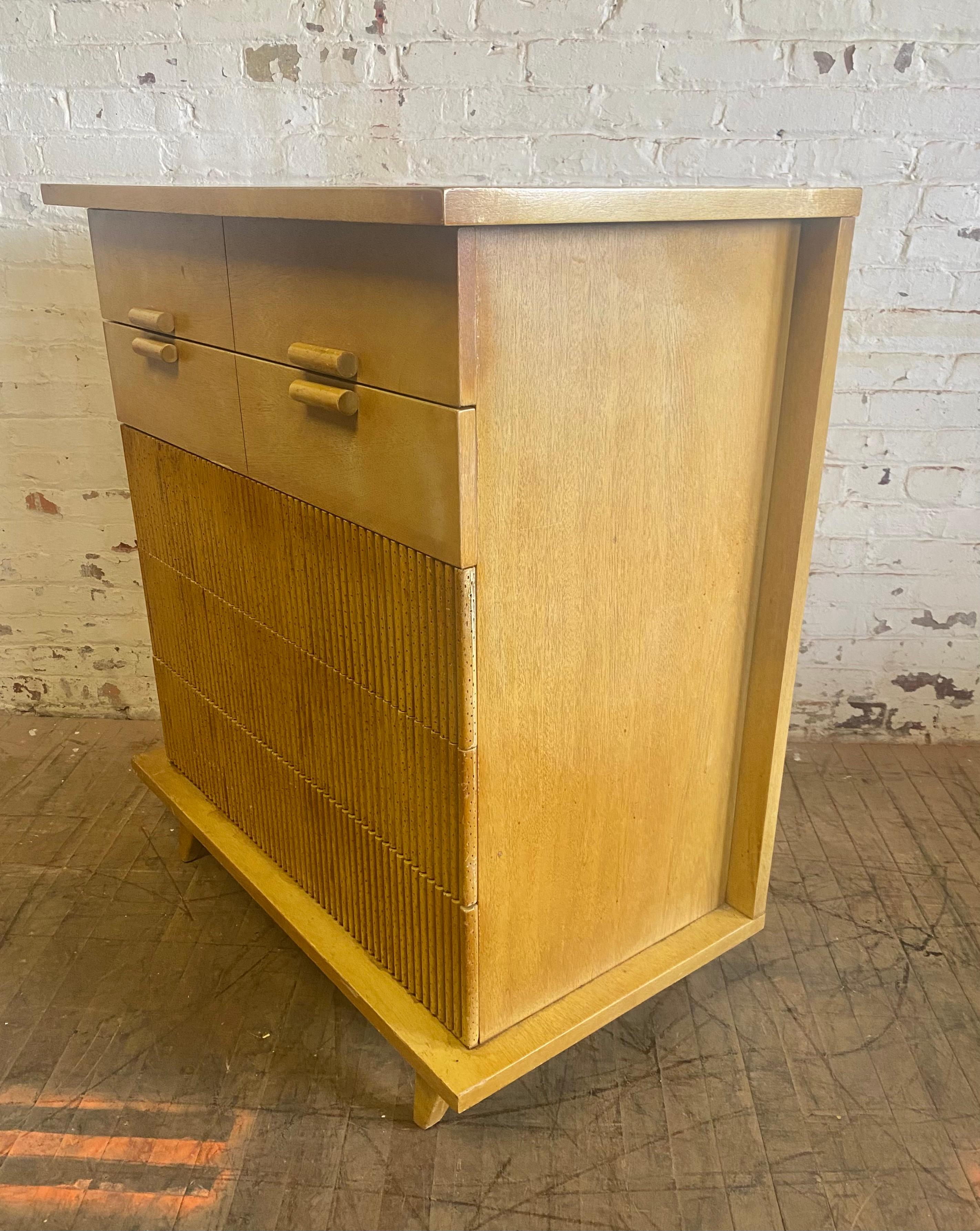 Five-drawer chest by American of Martinsville
1952

Bleached Philippine mahogany faux bamboo with five drawers.
The three bottom drawer front appliques are perforated to simulate the look of bamboo.

 Retains original finish, patina etc. Minor