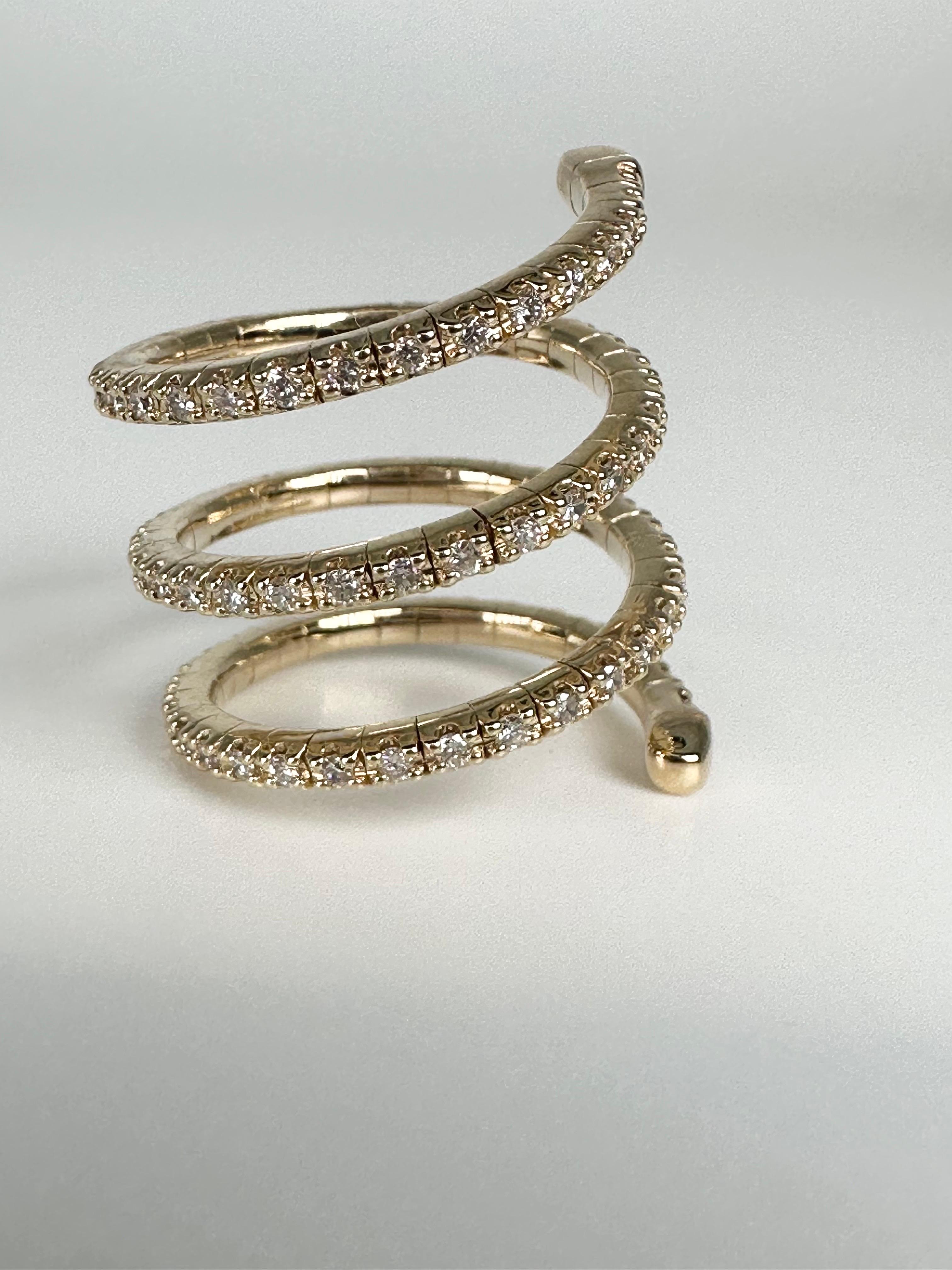 Rare diamond ring, spiral in design, comfortable on finger and suits most finger sizes, a must have for any fashionista! Did i mention its a diamond ring and the spakle is crazy? This is just such a unique ring and i know you will enjoy it!