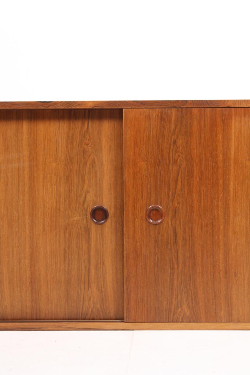 Rare wall-mounted sideboard in rosewood. Designed by Finn Juhl and made by Søren Willadsen in the 1950s. Great original condition.
