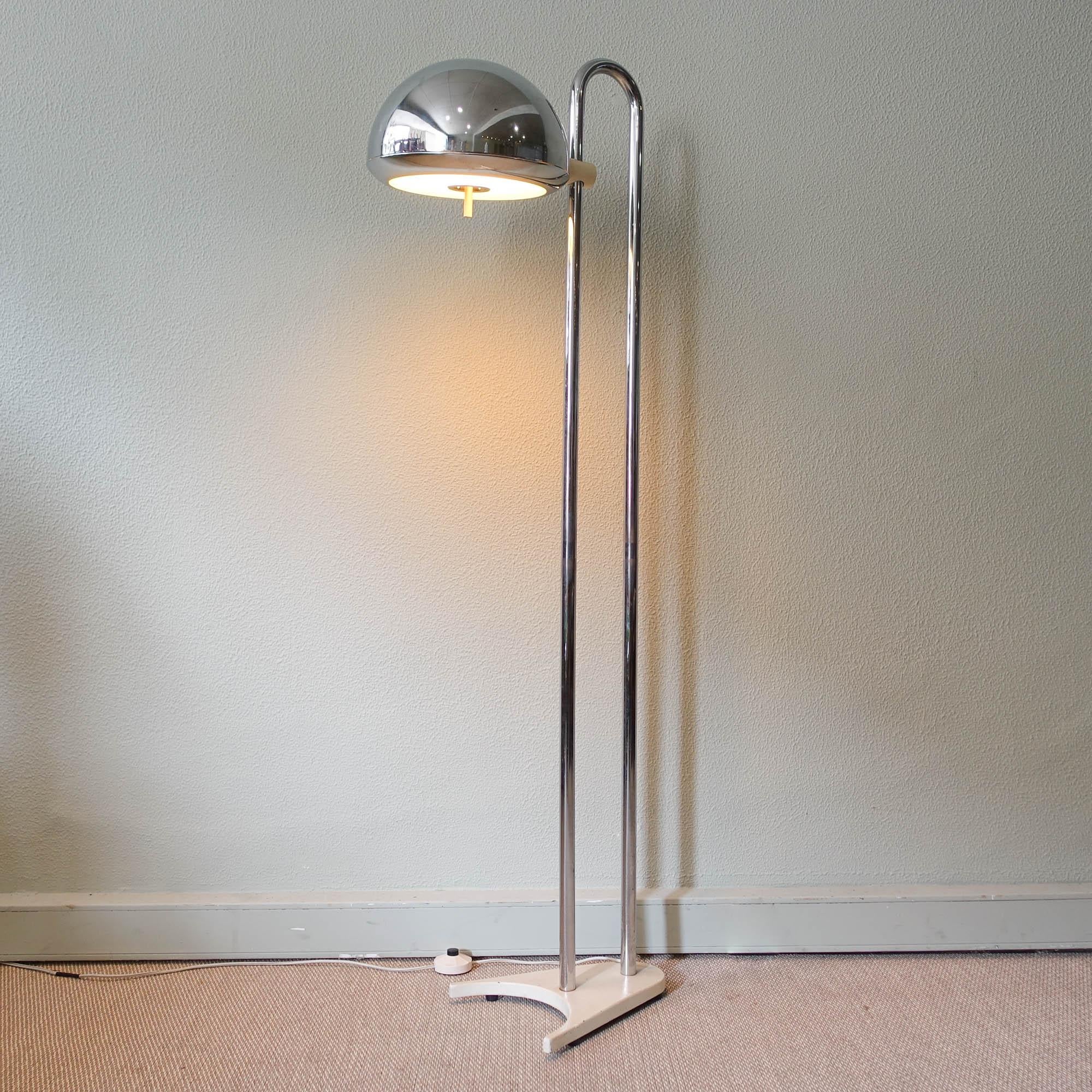 Step into the enchanting world of 1970s Spanish design with this exceptional floor lamp, crafted by Luis Perez de La Oliva and produced by Grin Luz. A rare find, it features a sleek white metal base supporting a gracefully bent chrome tube. The