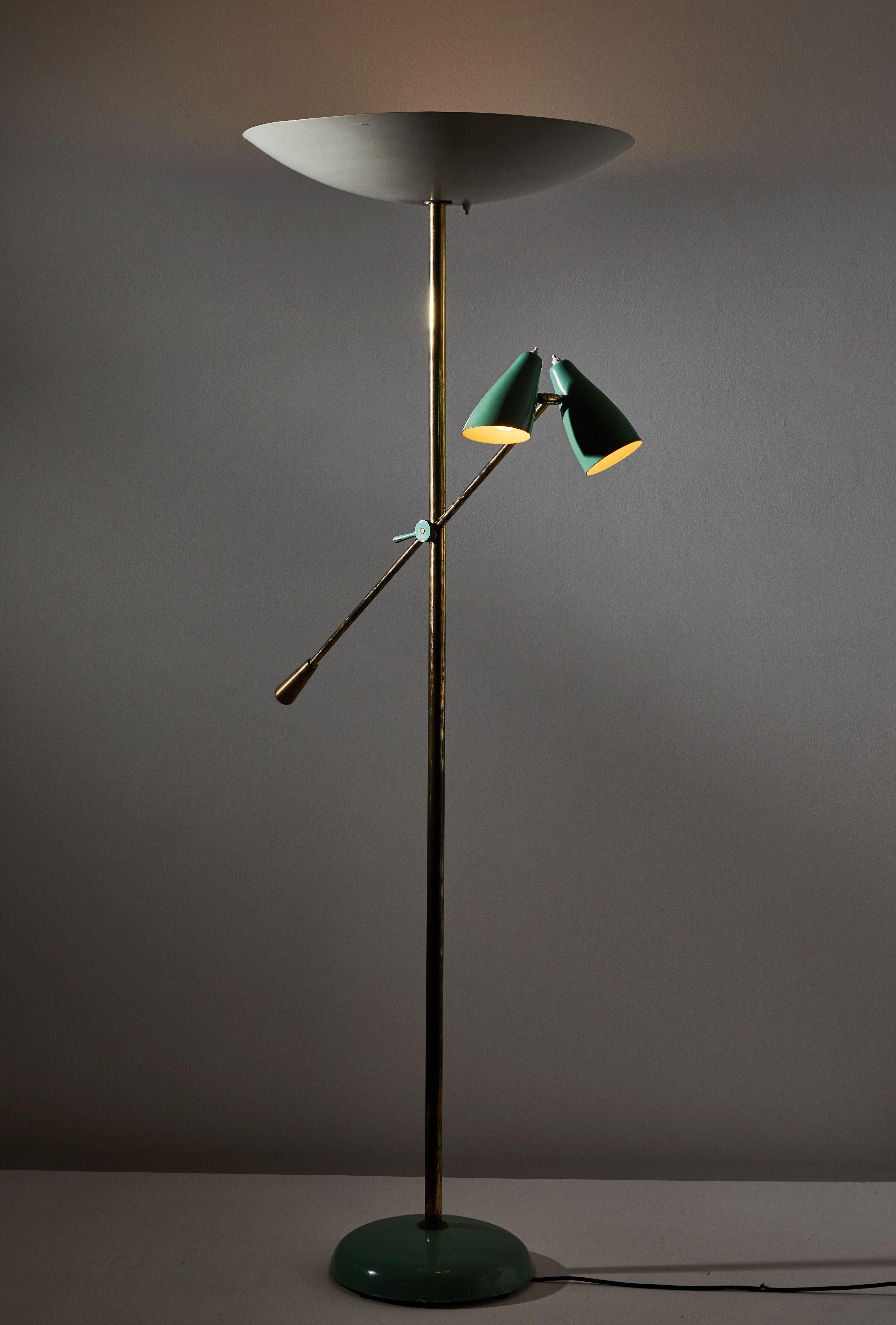 Rare floor lamp by Stilnovo. Manufactured in Italy, circa 1940s. All original enameled metal and patinated brass. Arm and shades adjust to various positions. Rewired with brown cloth cord. Five sockets E27 25w maximum bulbs and three E27 60w maximum
