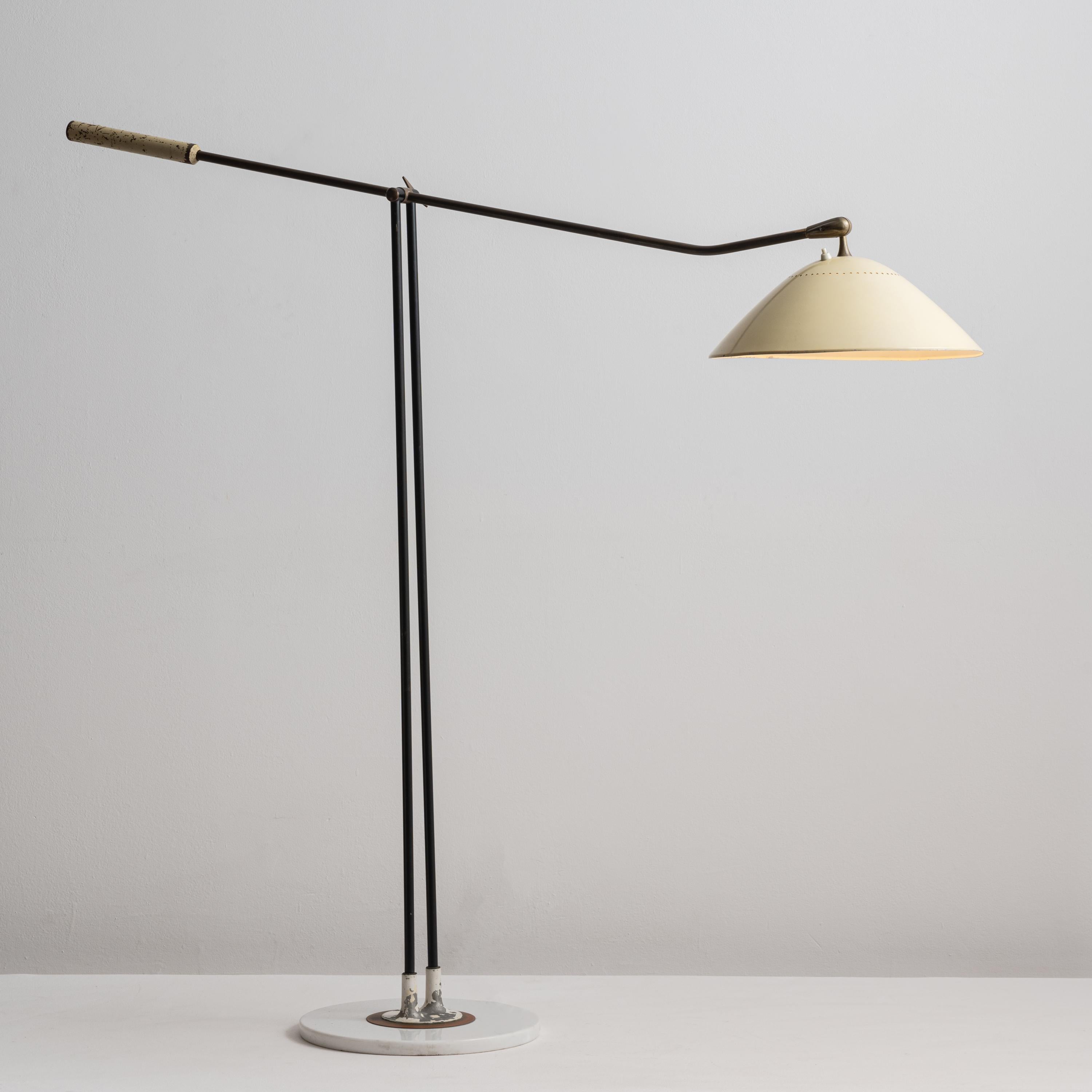 Rare Floor Lamp by Stilnovo. Designed and manufactured in Italy, circa 1950's. Patinated brass, enameled metal. U.S. plug. Pivoting/adjustable stem from 52