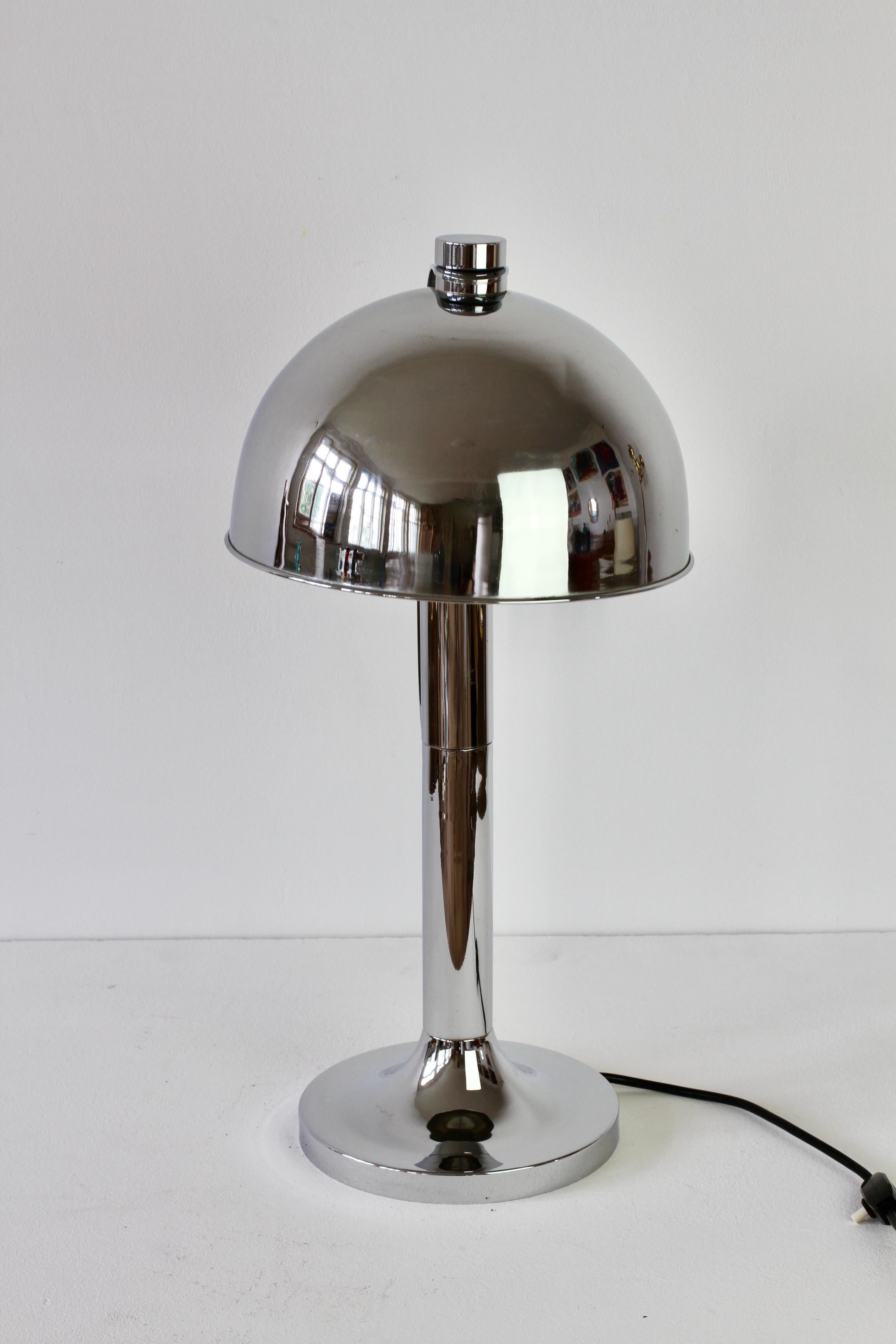 Rare Mid-Century Modern vintage German made table lamp or desk light by Florian Schulz circa 1970s. Featuring polished chrome plated brass hardware (now with age related patina) and an adjustable round shade making this the perfect modernist style