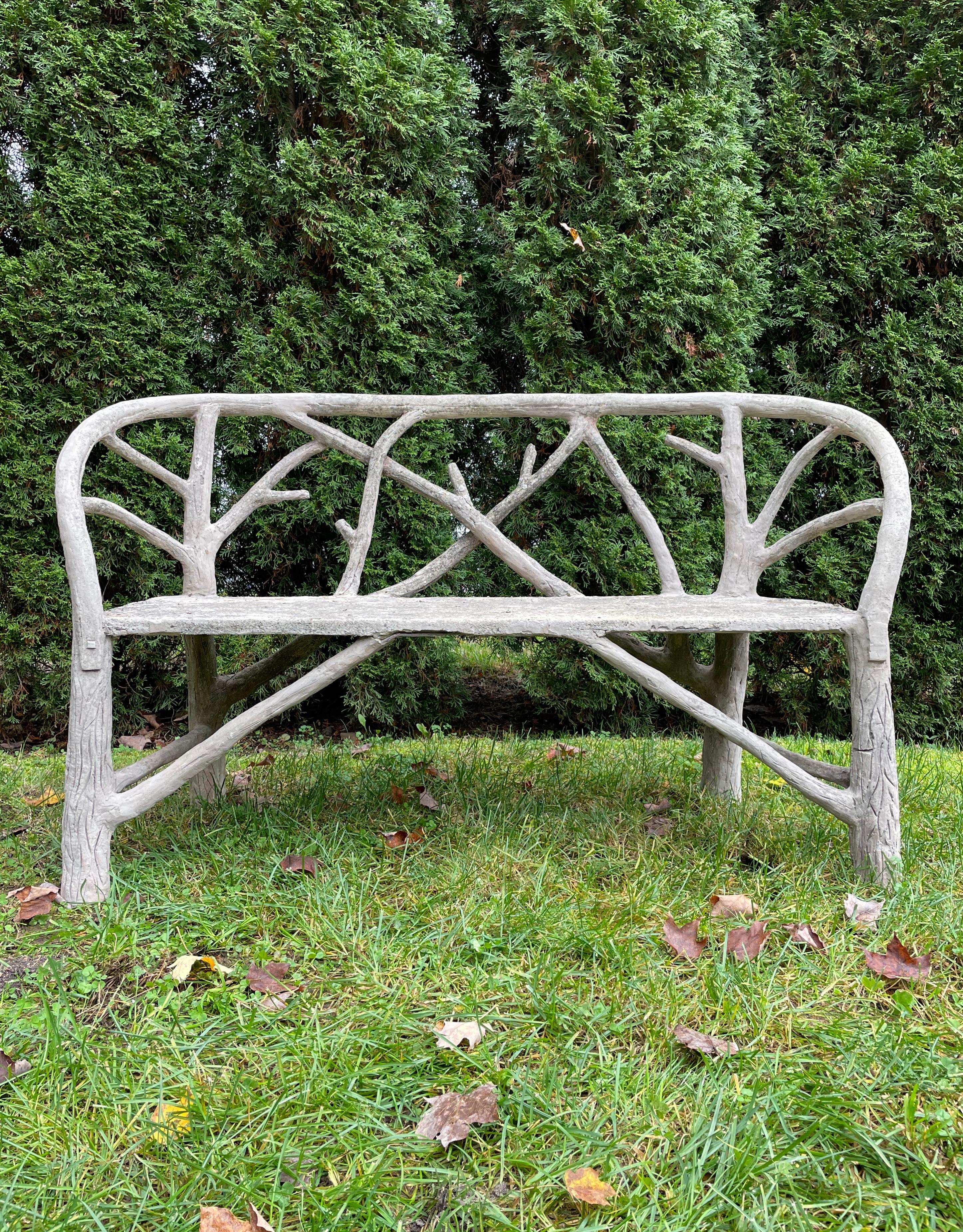 What a stunner! This rare form faux bois bench was hand-made in the 1940s and is in wonderful, restored condition. Its gently-curved back with branch decoration is very comfortable and there are wonderful little details like the “latches” on the
