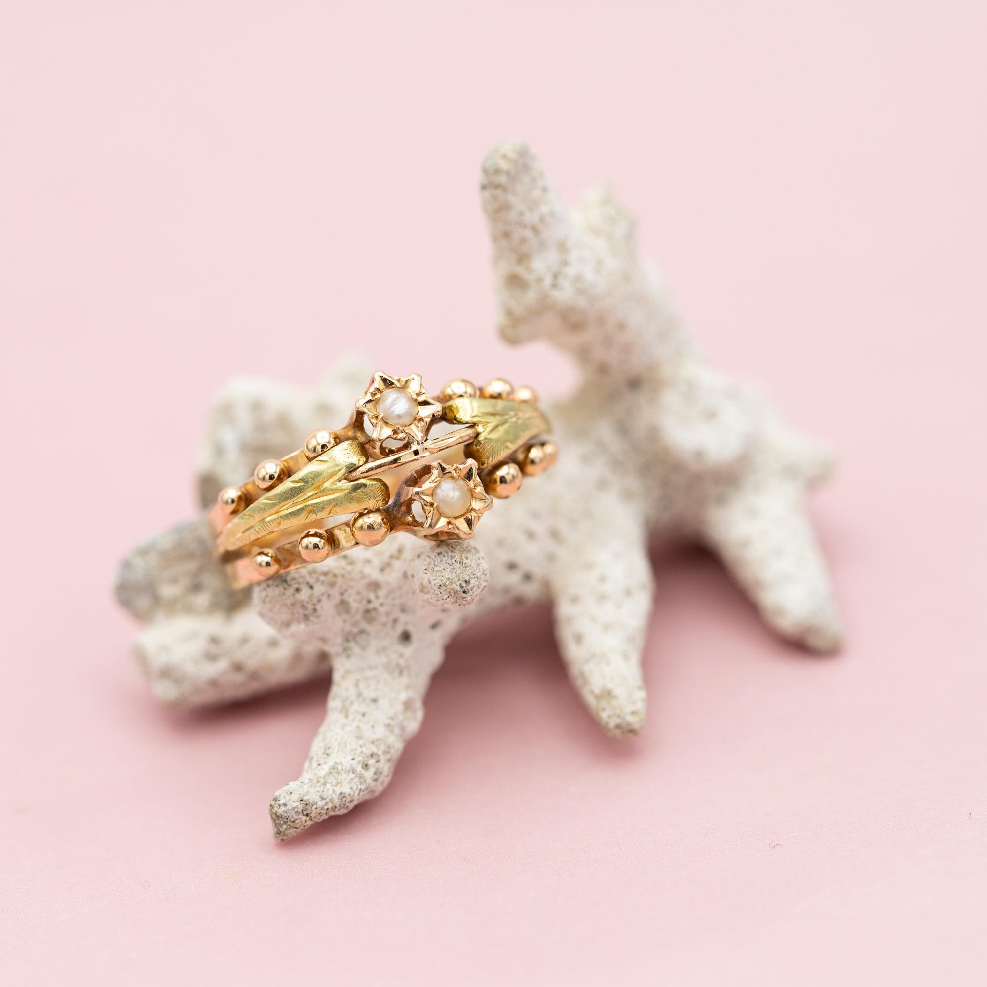 For sale is antique rose gold ring which stole our hearts the minute we laid eyes on her. This marvellous flower ring is made in 18 K rose gold and decorated with two pearl set flowers and little ball shaped studs. The white flower centres are
