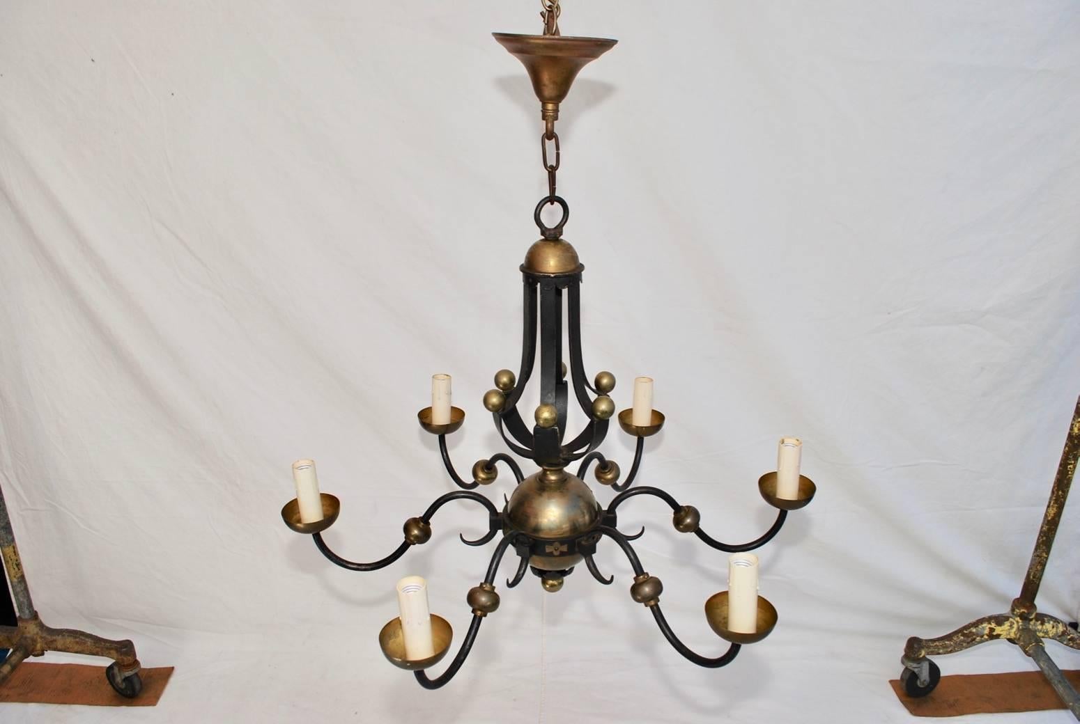 A beautiful French wrought iron and brass by the iconic Gilbert Poillerat, the patina is much nicer in person.

 