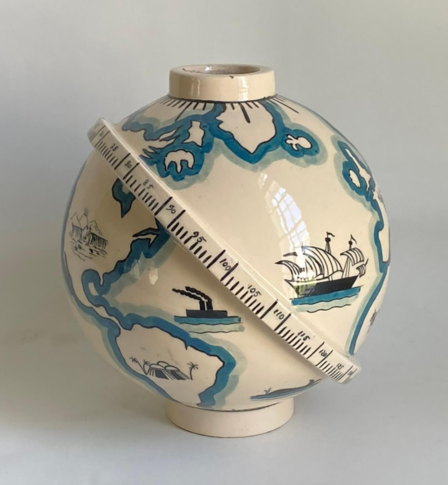 Here is a wonderful and rare art deco globe vase made by the famed French ceramist Robert Lallemant (1902-1954). This spherical vase represents the globe with depiction of various continents, ships and scenes from around the world. The vase is
