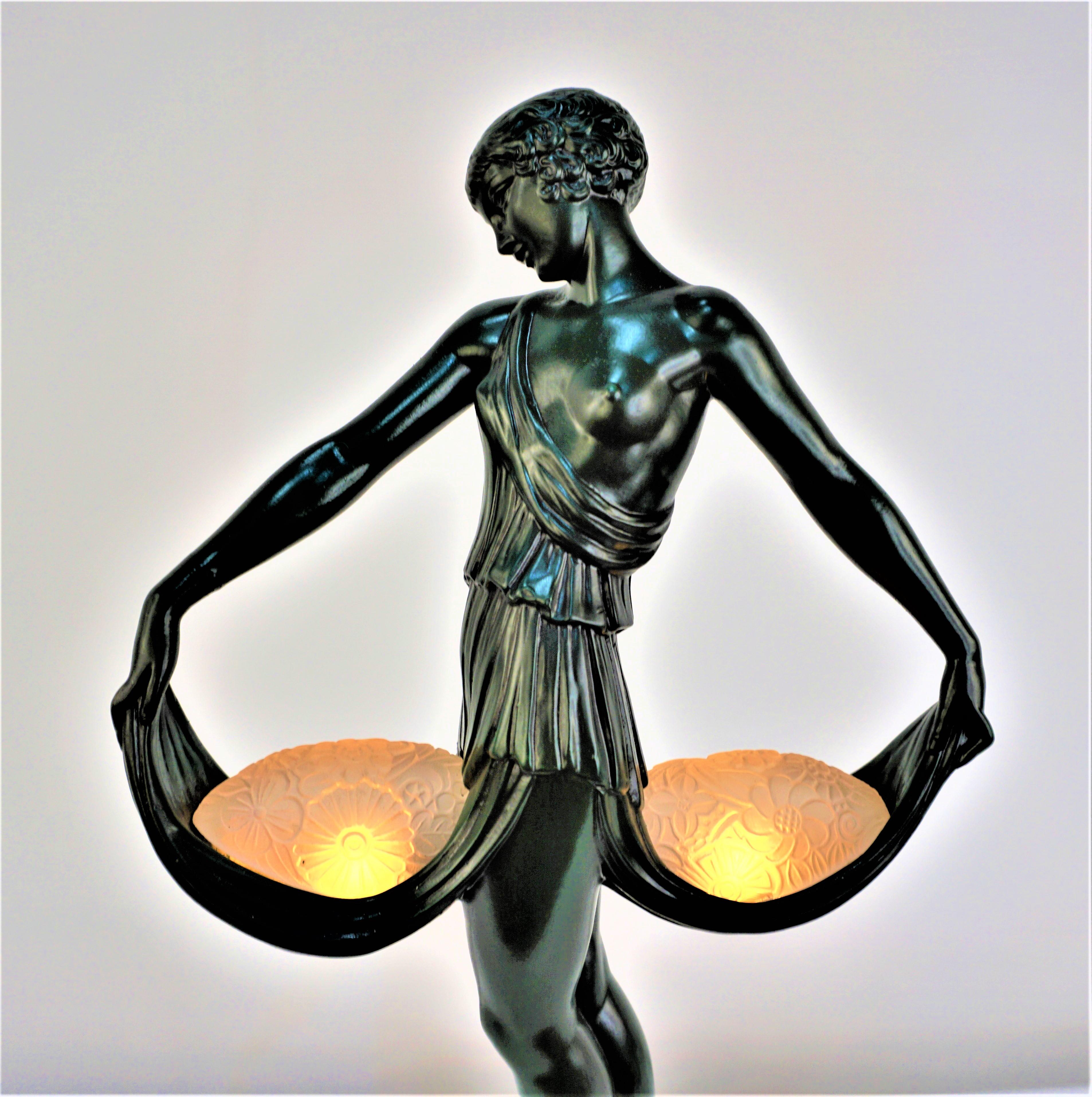 Very rare art deco sculpture table lamp two flower glass shade with light under placed on her front and back skirt hold up by her hands. 
Signed Fayral(Pierre Le Faguays) with Paris Verrier foundry mark.