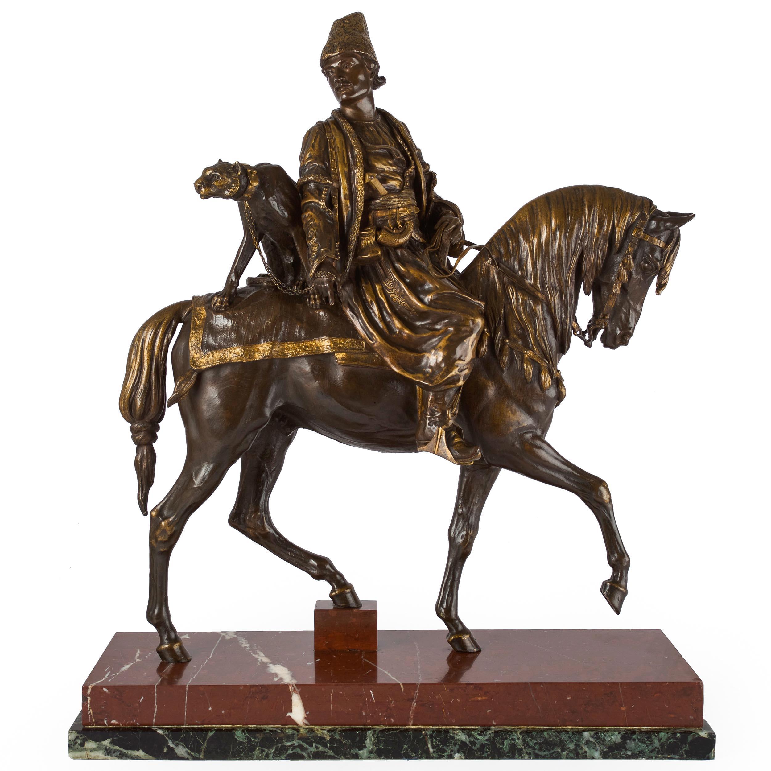 A very fine and quite rare model of Un Chasseur Persan au Guépard, conceived in 1878 and exhibited at the Paris Salon in 1879; it was for this group that Dubucand was awarded the rare honor of a Gold Medal. It is a very infrequent find on the open
