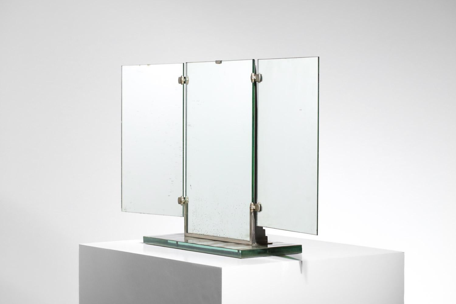 Very pretty art deco triptych table mirror from the 40s/50s by Brot Paris. Base in thick glass slab, rear mirror structure in chromed metal and lacquered on the sides (original paint). Very nice vintage condition, note traces of oxidation throughout