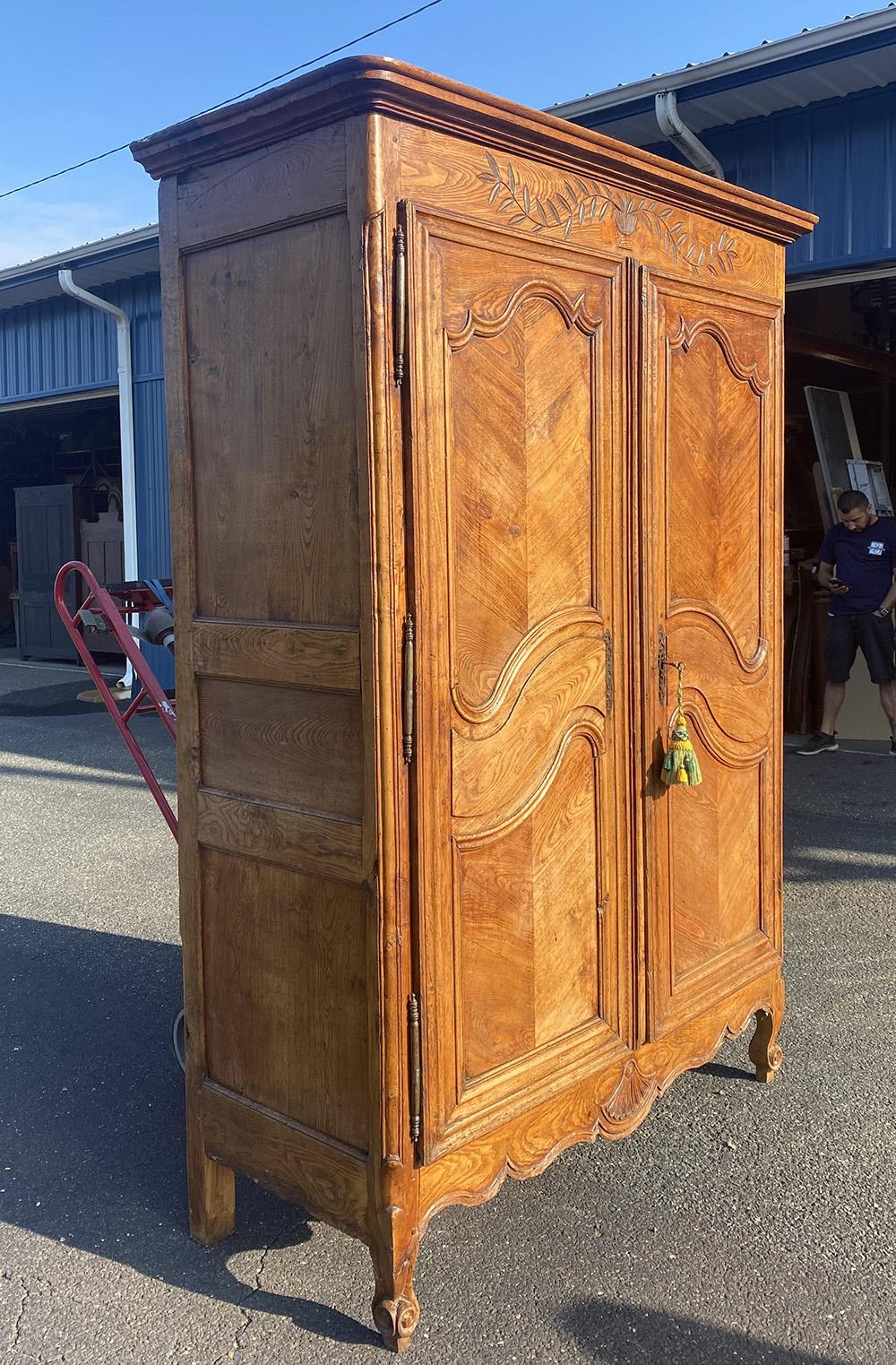 Late 18th Century Rare French Country Louis XV Carved Chestnut Armoire with Flowers