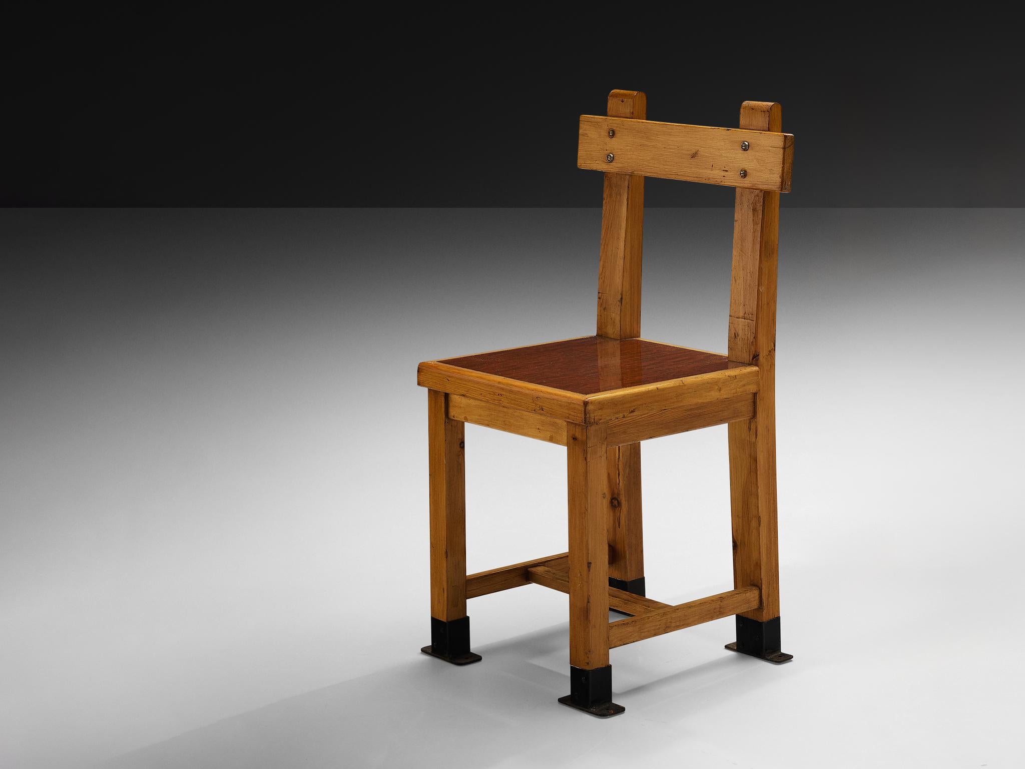 Dining chair, pine, metal, France, 1940s

This French dining chair showcases a striking design with its strong, clean lines that structure the piece in a visually compelling way. The black metal feet are a standout feature, perfectly complementing