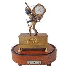 Rare French Empire ormolu and patinated bronze portefaix clock signed Alibert