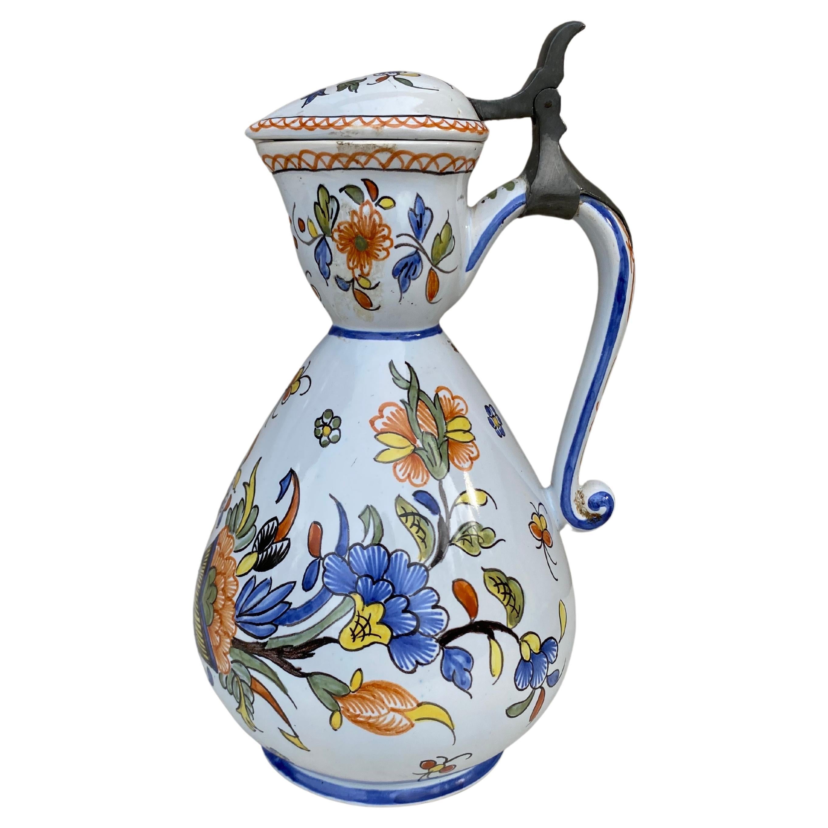 Rare French Faience Pitcher with lid Rouen style Circa 1900.
Floral painting and cornucopia.