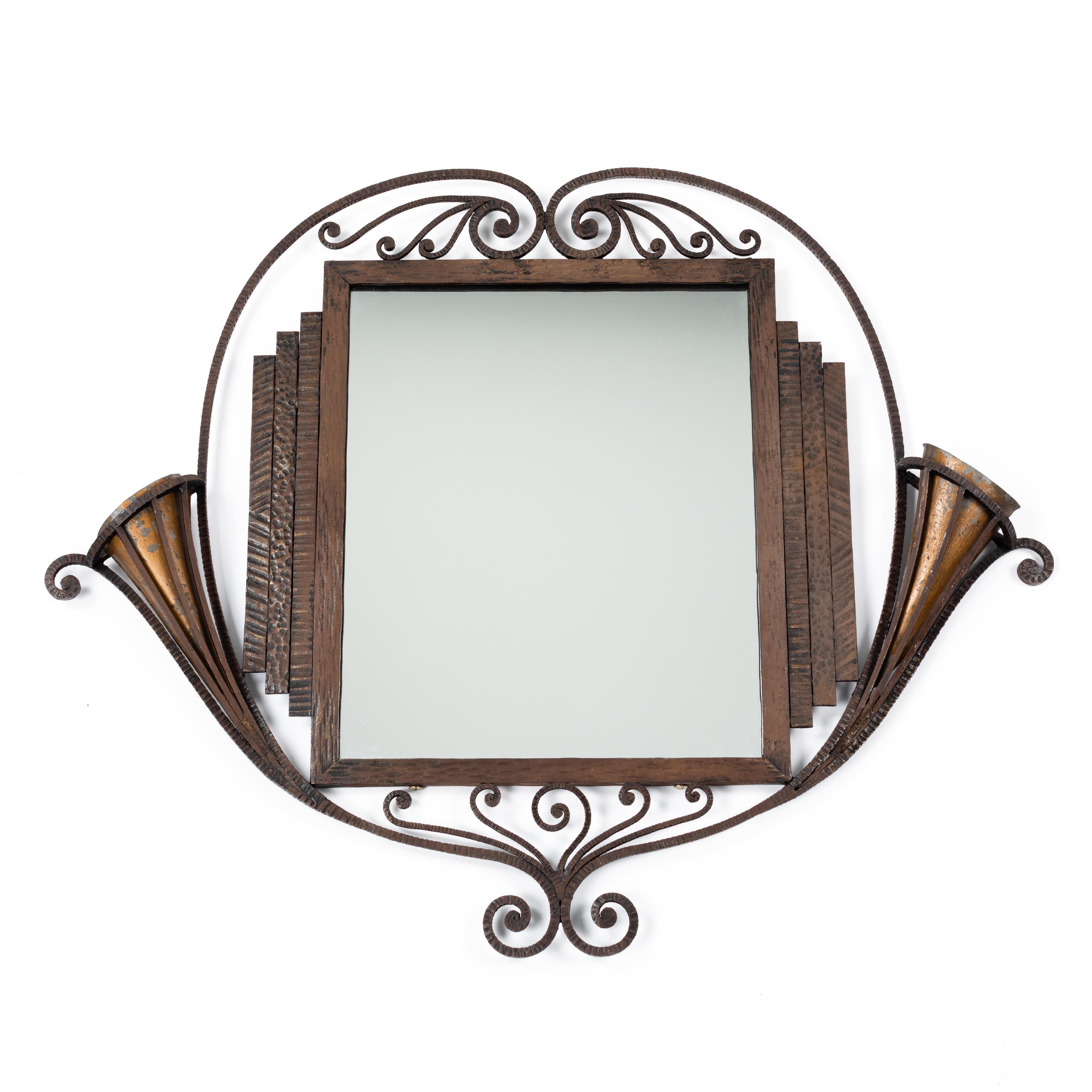 Rare and very special French forgend iron Art Deco mirror form the early 1920s by Charles Piguet

The rectangular frame is made of forged iron (with fluted surface). 
On the right and left appear geometric, stepped elements - top and bottom floral,