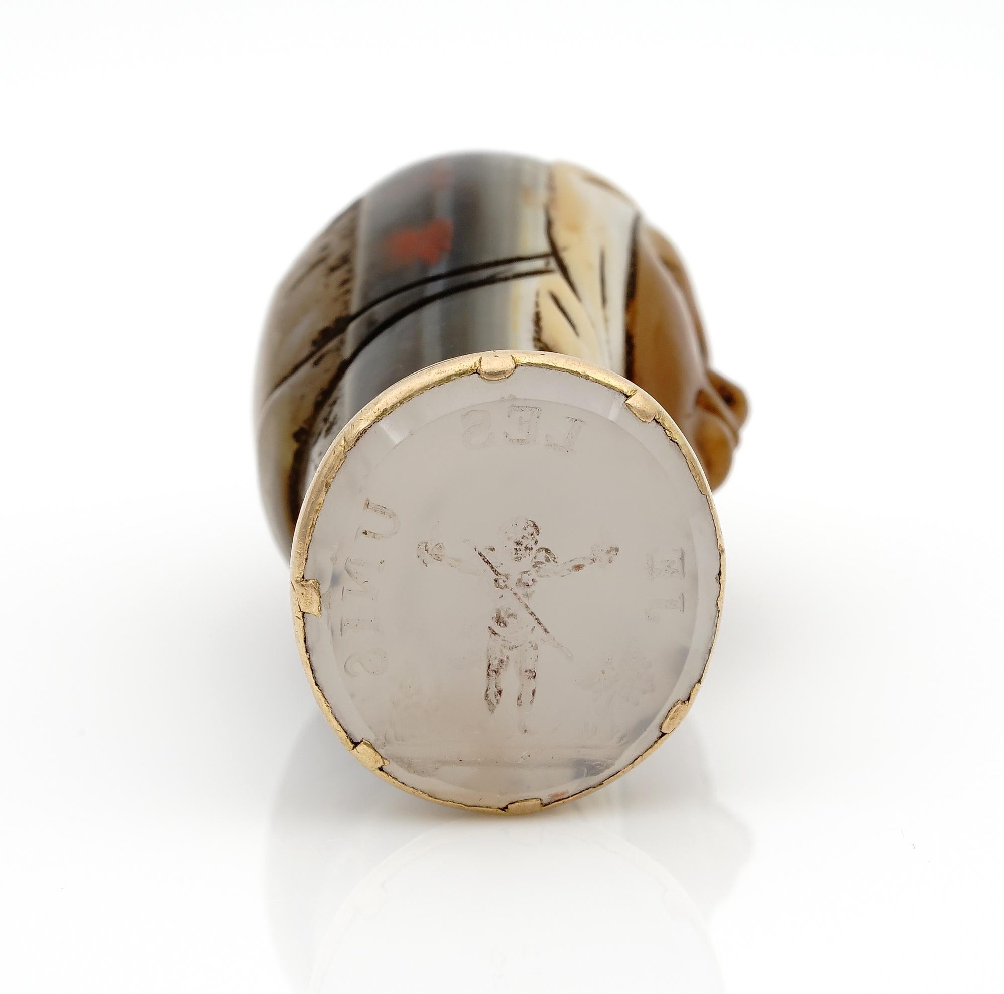 Rare Past Treasures

Georgian Period, possibly 1750 or even earlier, unusual and rare seal fob
Interesting carving of a face with covered head made from banded Agate- beautifully hand executed
Mounted in 18 kt solid gold 
French origin; seal is of