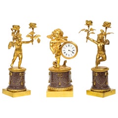 Rare French Gilt-Bronze Ormolu and Porphyry Three-Piece Clock Set, circa 1880