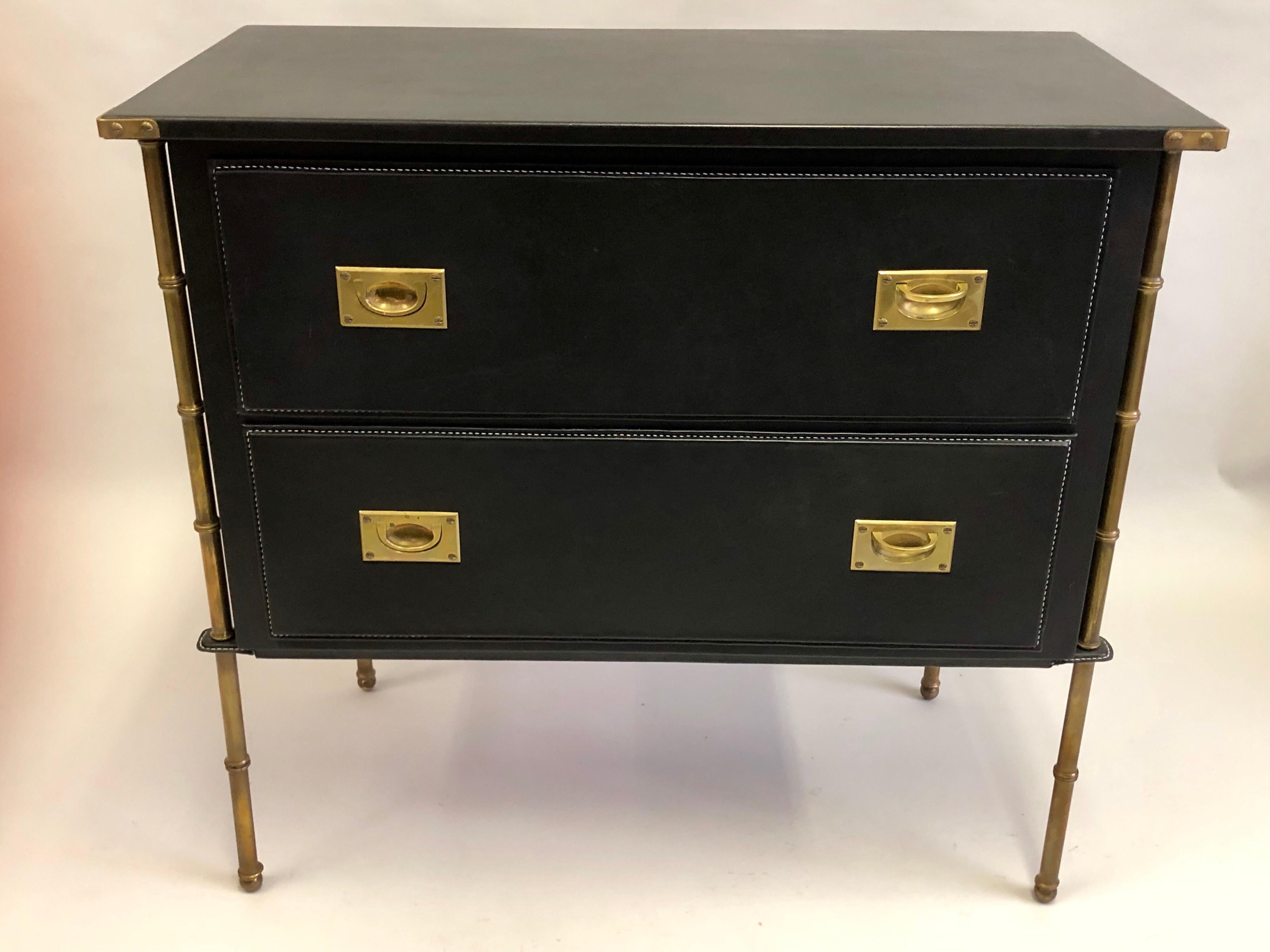 French Mid-Century Modern neoclassical hand-stitched leather cabinet, dresser, commode, chest of drawers, console or sofa table by Jacques Adnet.

The entire composition is subtly balanced with muted black leather and burnished brass coloration.