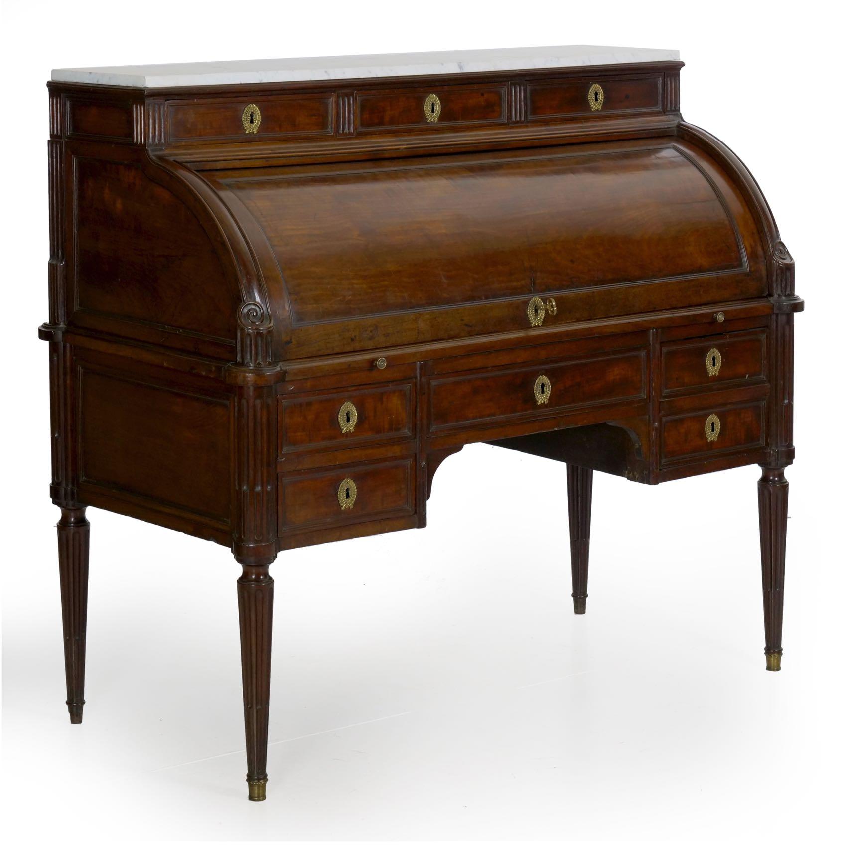 A rare find in this form and condition, this fine Louis XVI cylindrical writing desk is a powerful presentation piece. Crafted during the last quarter of the 18th century using rich and dense mahogany woods, the surface has taken on a gorgeous