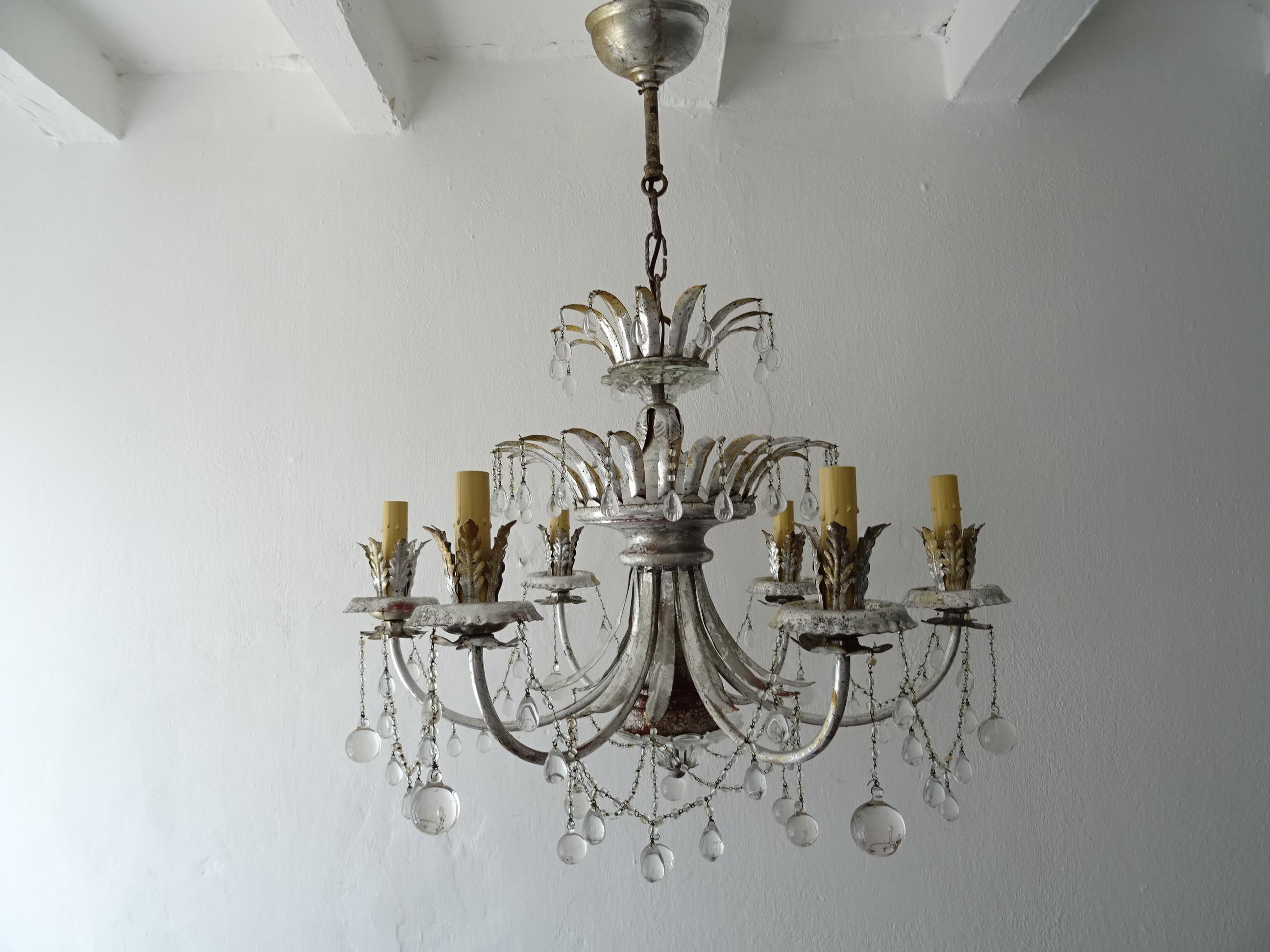 Housing 6 lights, will be newly rewired with certified US UL sockets for the USA and appropriate socket for all other countries. A rare example of Maison Baguès. Tiers of hand tied crystal macaroni beads and Murano glass balls in 3 different sizes,