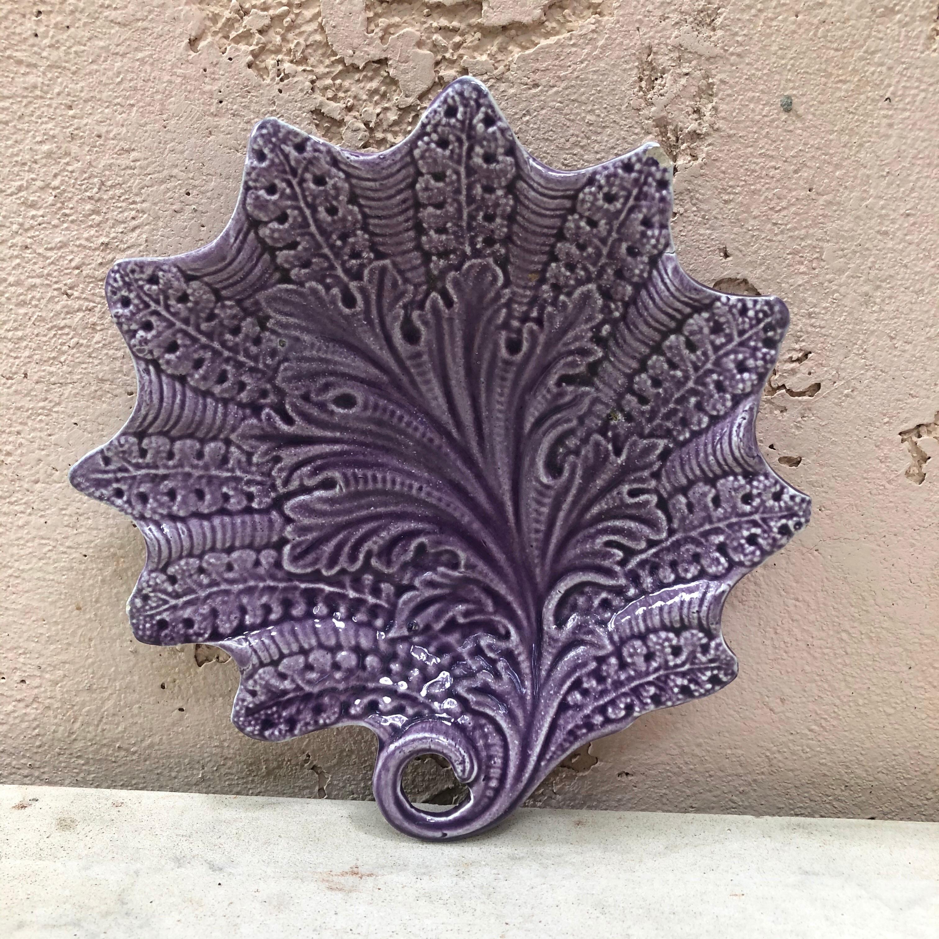 Rare French Majolica purple dish with a curled leaf-stem handle signed Onnaing, circa 1890.