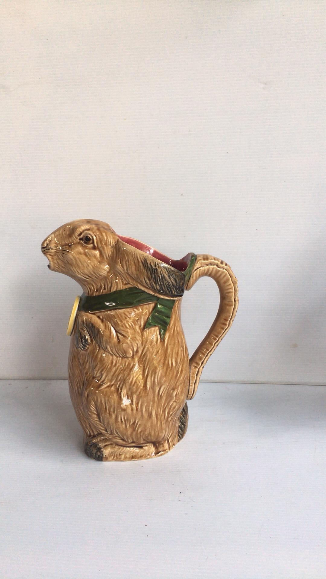 French Majolica pitcher beige rabbit with a medal 1900, made for the International Exhibition in Paris of 1900.
The pitcher is stamped by the store where he was sold Compagnie Franco Anglaise 78 rue de turbigo in Paris.