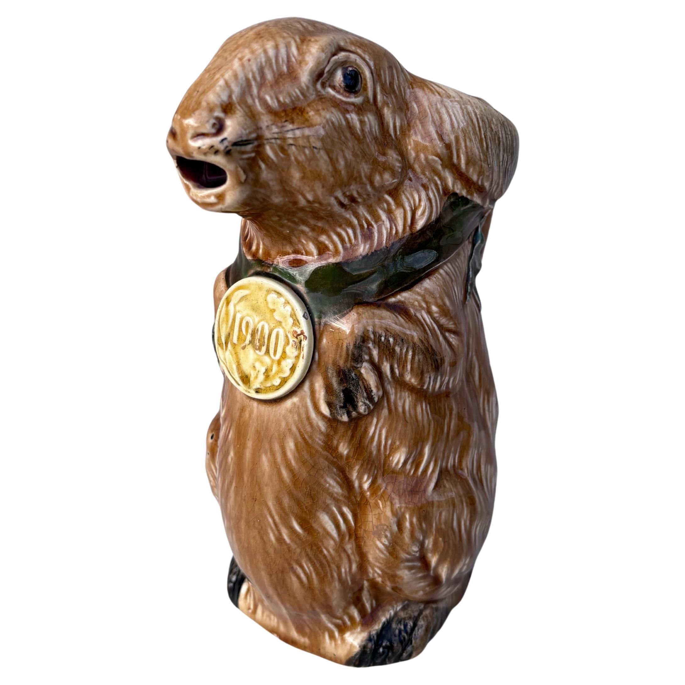 French Majolica beige pitcher rabbit with a medal 1900, made for the International Exhibition in Paris of 1900.
The pitcher is stamped by the store where he was sold Compagnie Franco Anglaise 78 rue de turbigo in Paris.