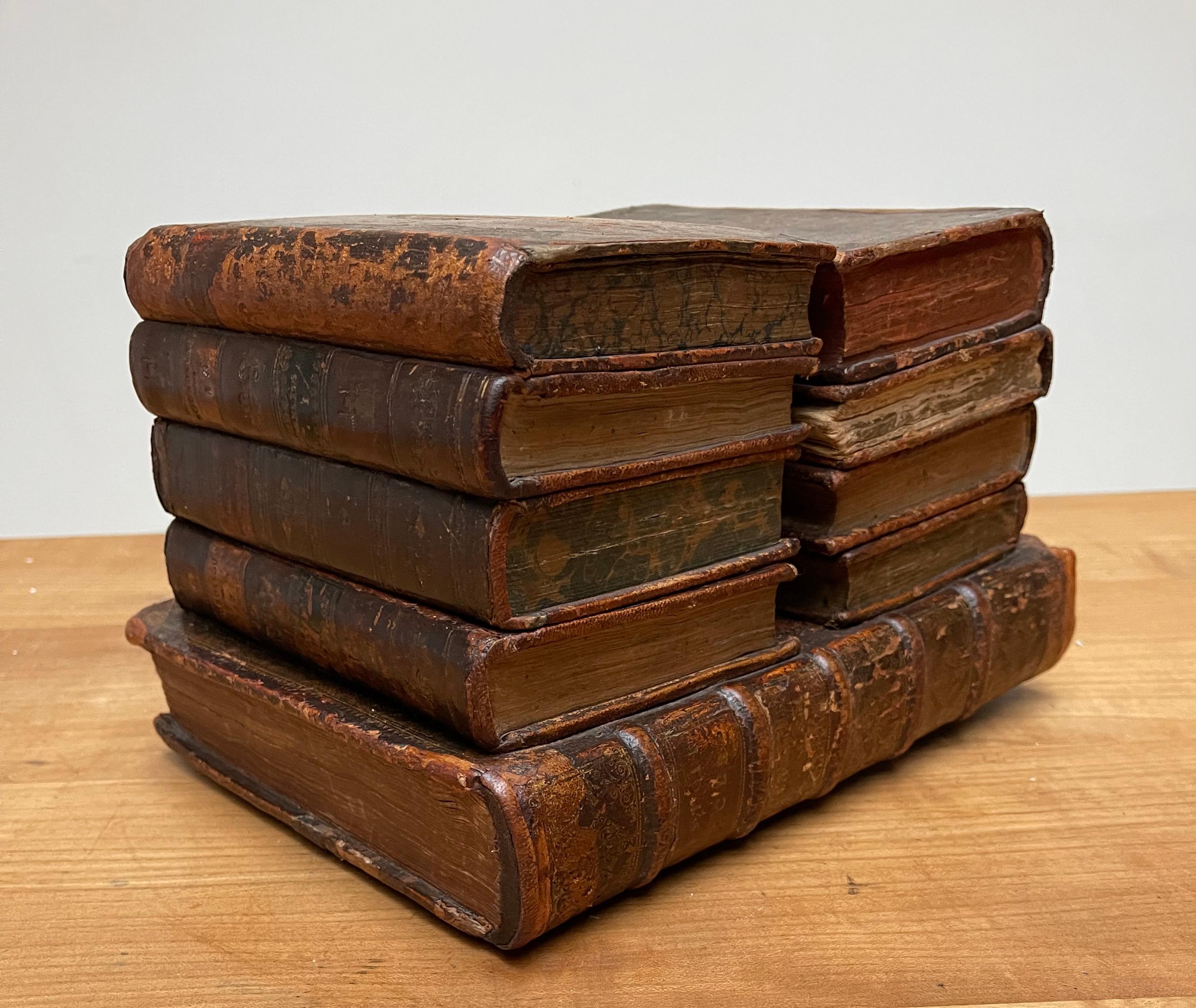 Unique double stack of leather books design liquor tantalus with hidden glasses & decanters.

If you are looking for the most interesting and worldly gift for yourself, a friend or a loved one then this magnificent antique drinks box could be